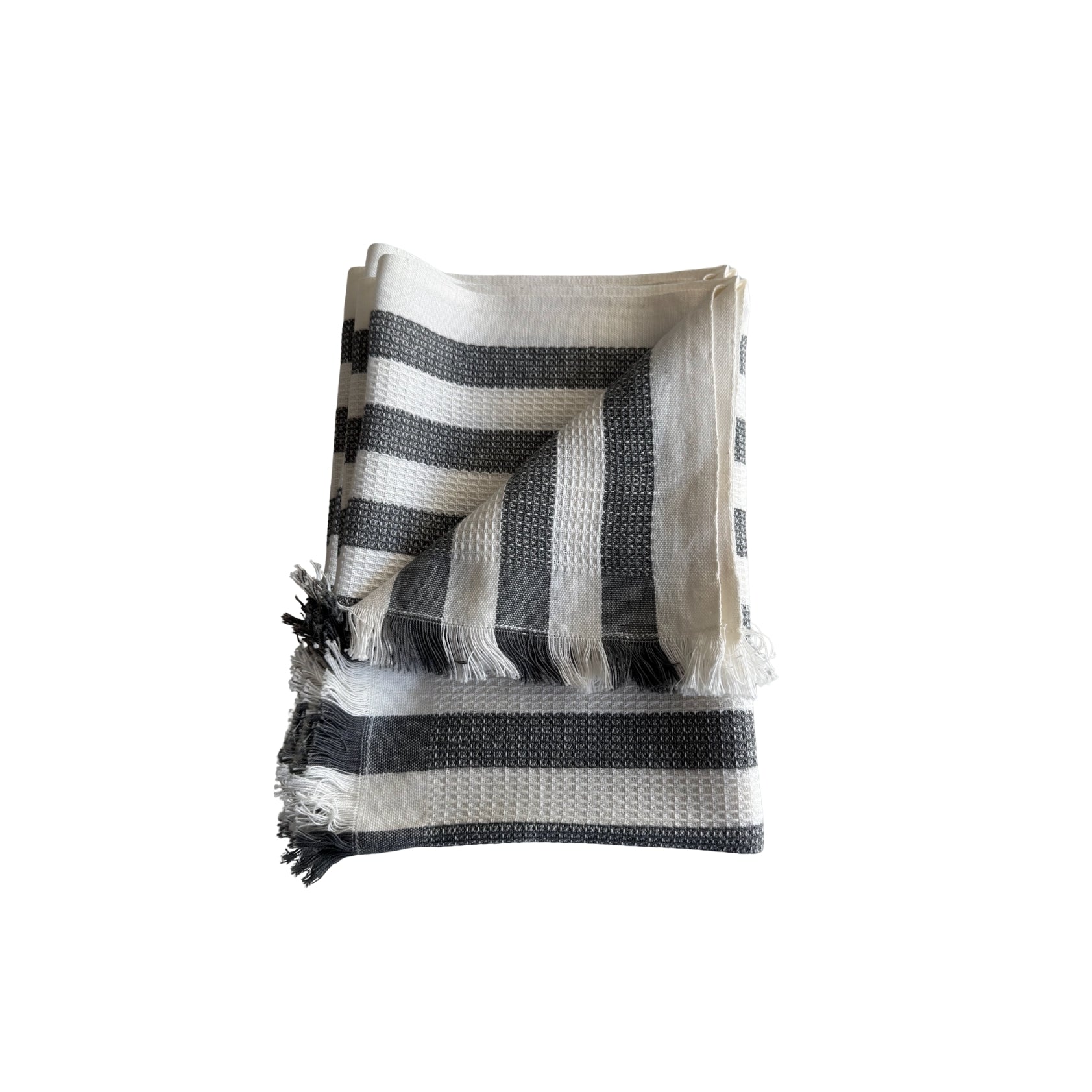 Grey and white striped towel with frayed ends.
