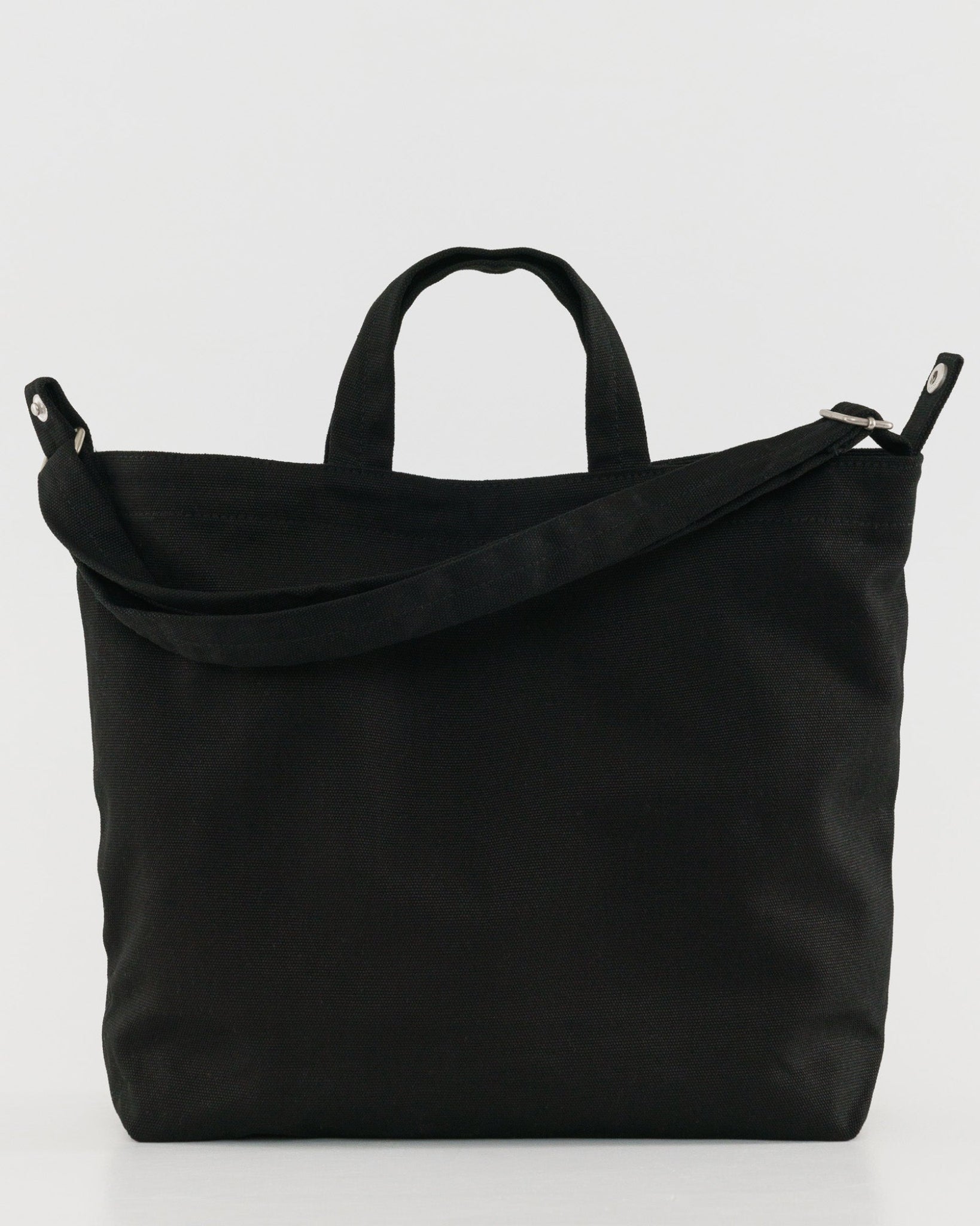 Black tote bag with adjustable shoulder strap and short handles.