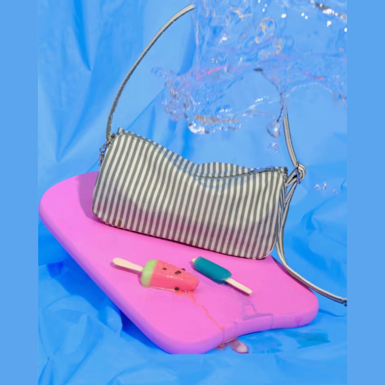 Green and cream stripe on loaf bag on a pink float in a blue pool