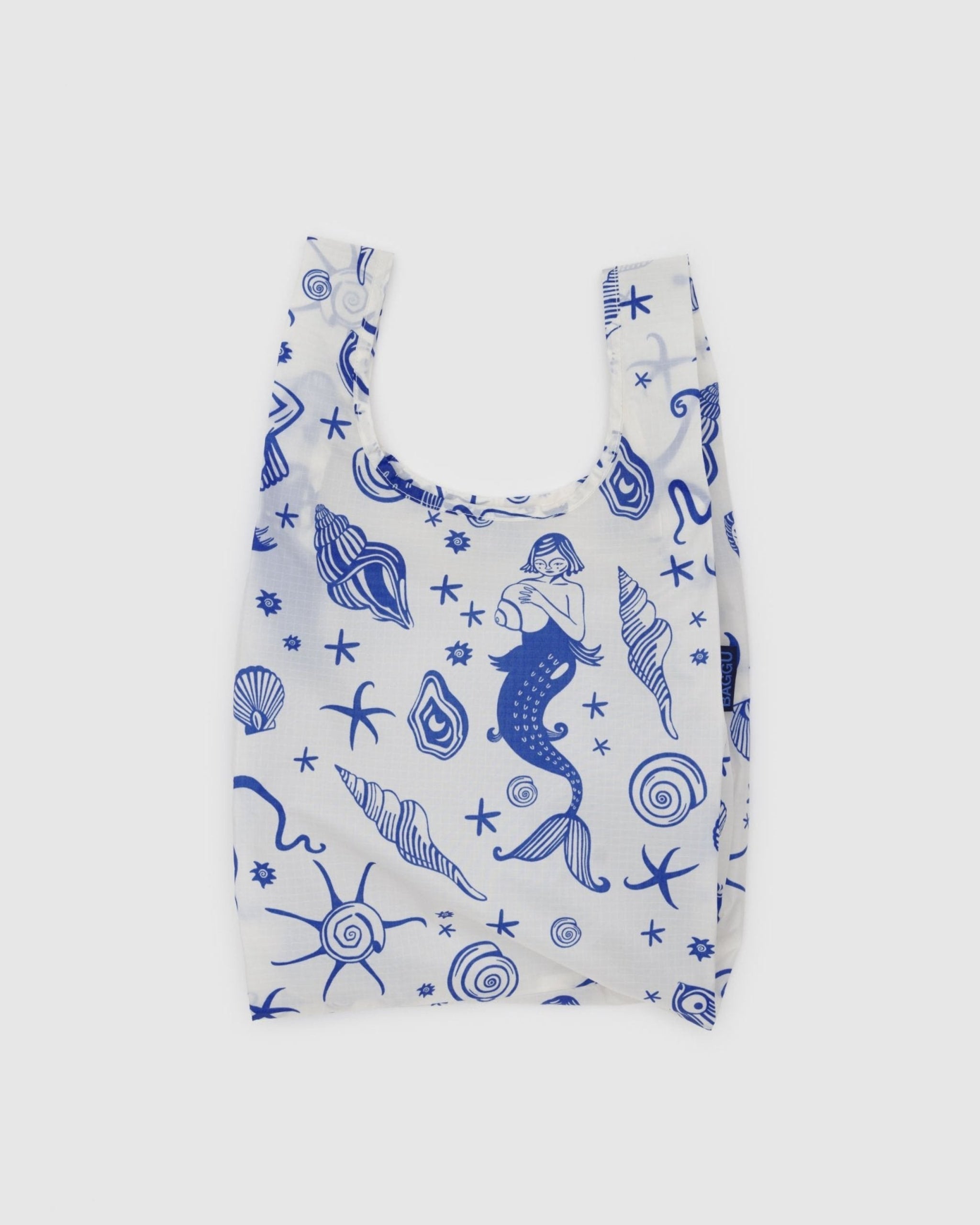 Mermaid print in blue on a white tote bag.
