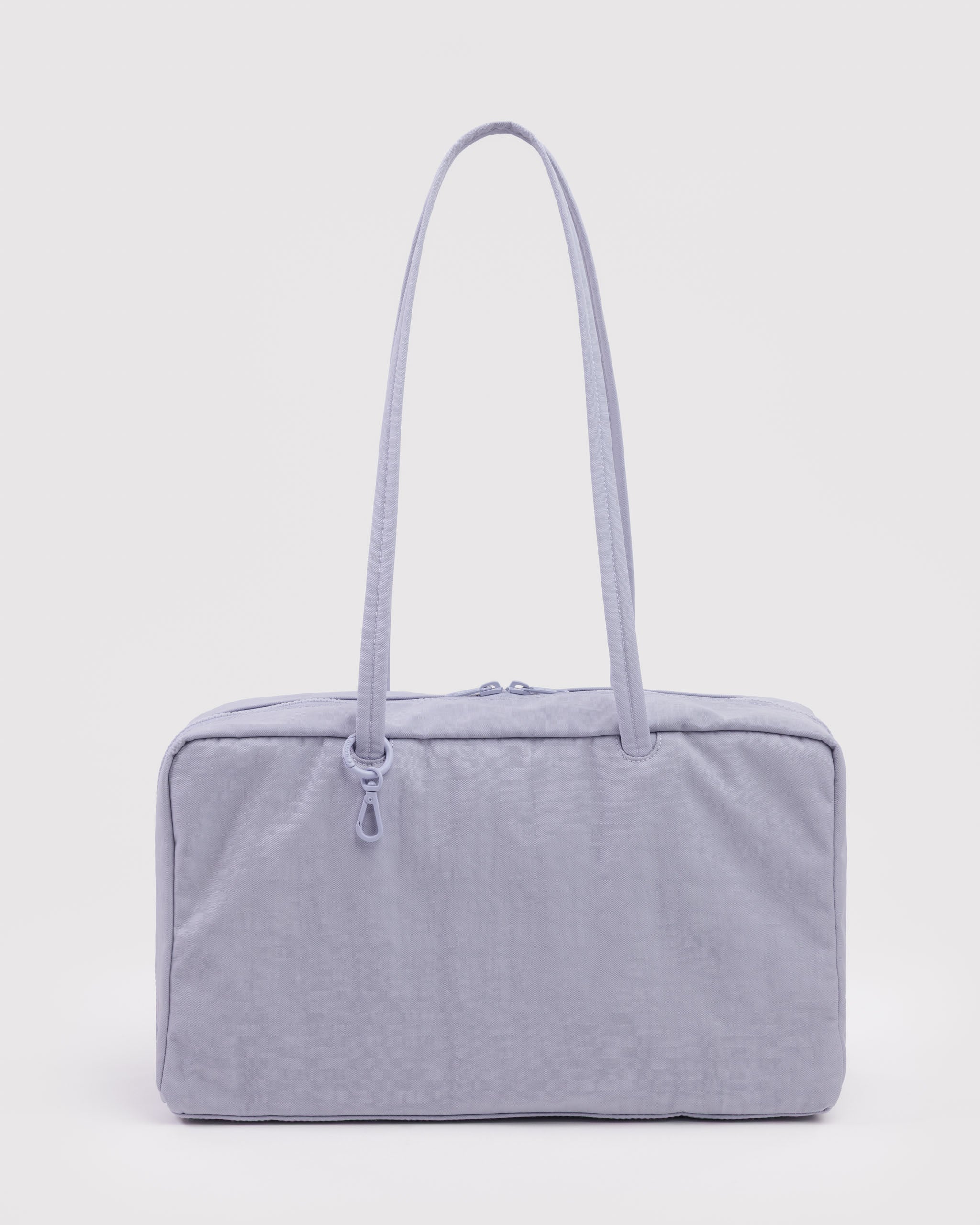 Light blue shoulder handbag with a long carry strap, double top zips and tonal ring with a clip.