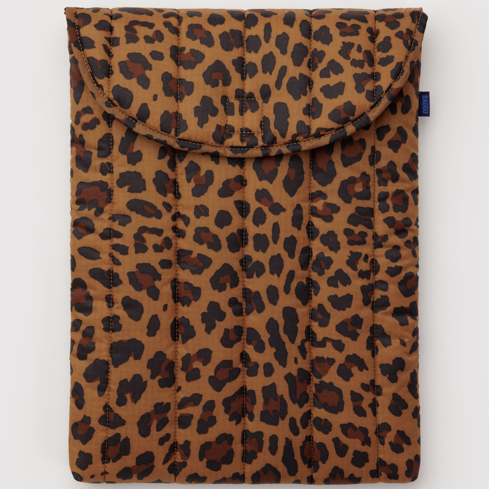 Quilted leopard print pouch with velcro closure top lid and BAGGU label at side.