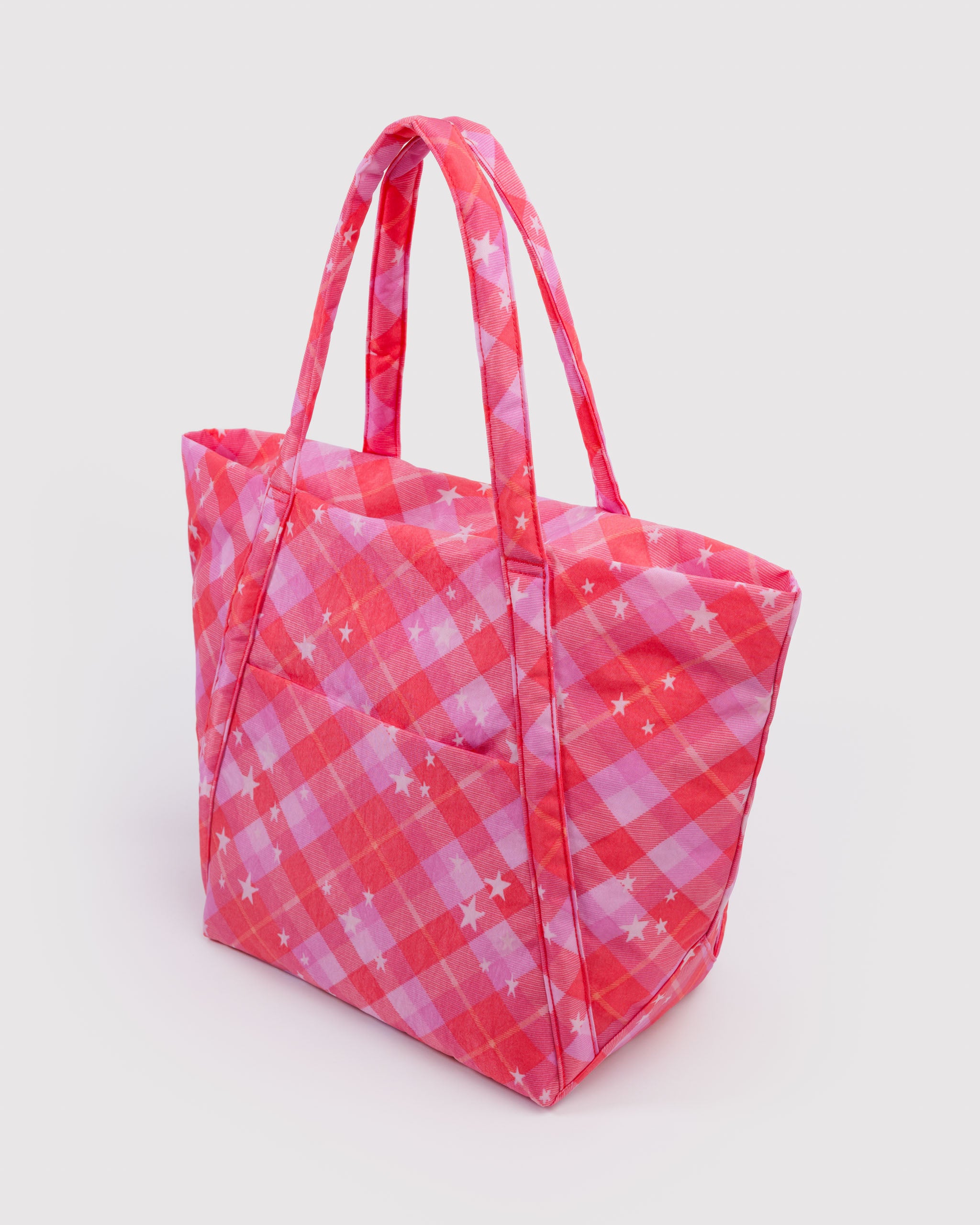 Pink checkered tote bag with shoulder straps and exterior pocket.