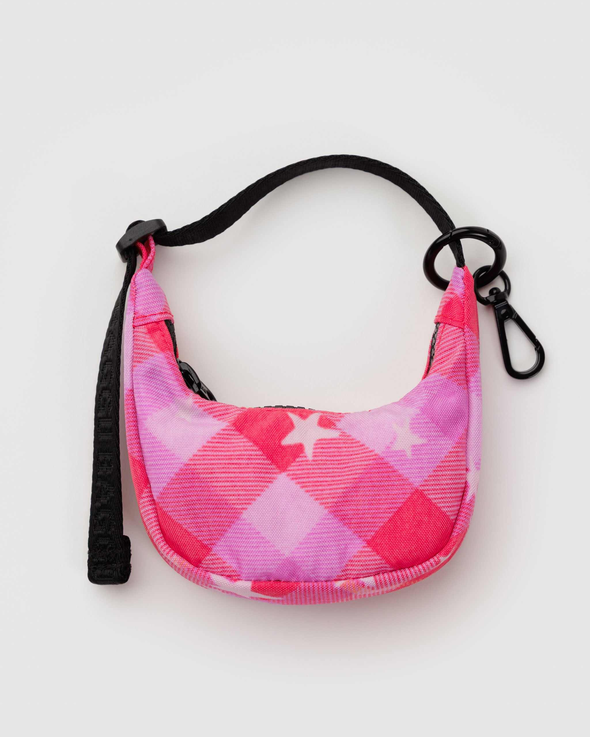 Pink and purple checkered crescent bag charm with stars print a black adjustable strap and keyring.