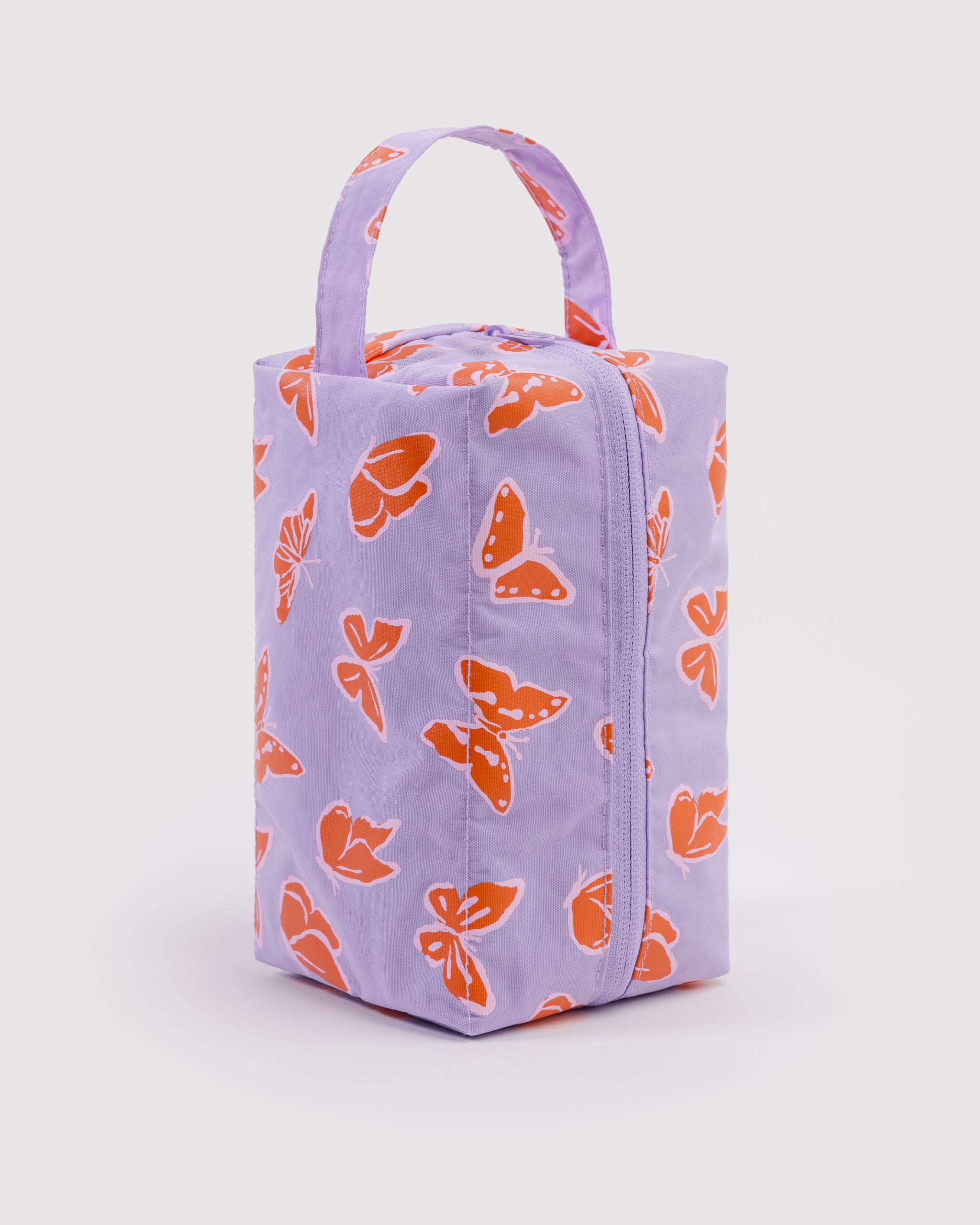 Purple cosmetic bag with orange butterfly pattern, a top zip and carry handle or hanging loop.