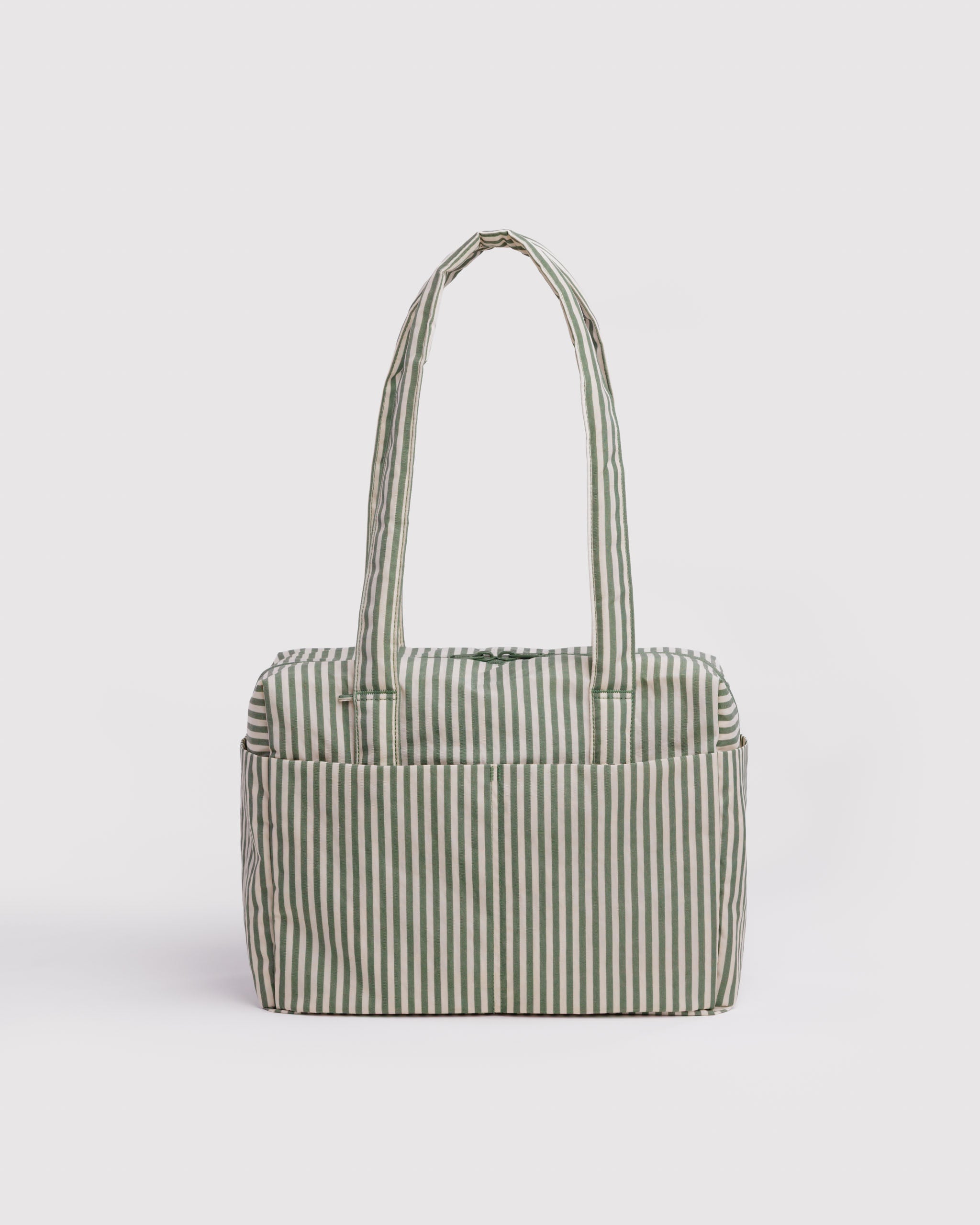 Green and cream striped tote bag with handles, op zip closure and external slip pockets.