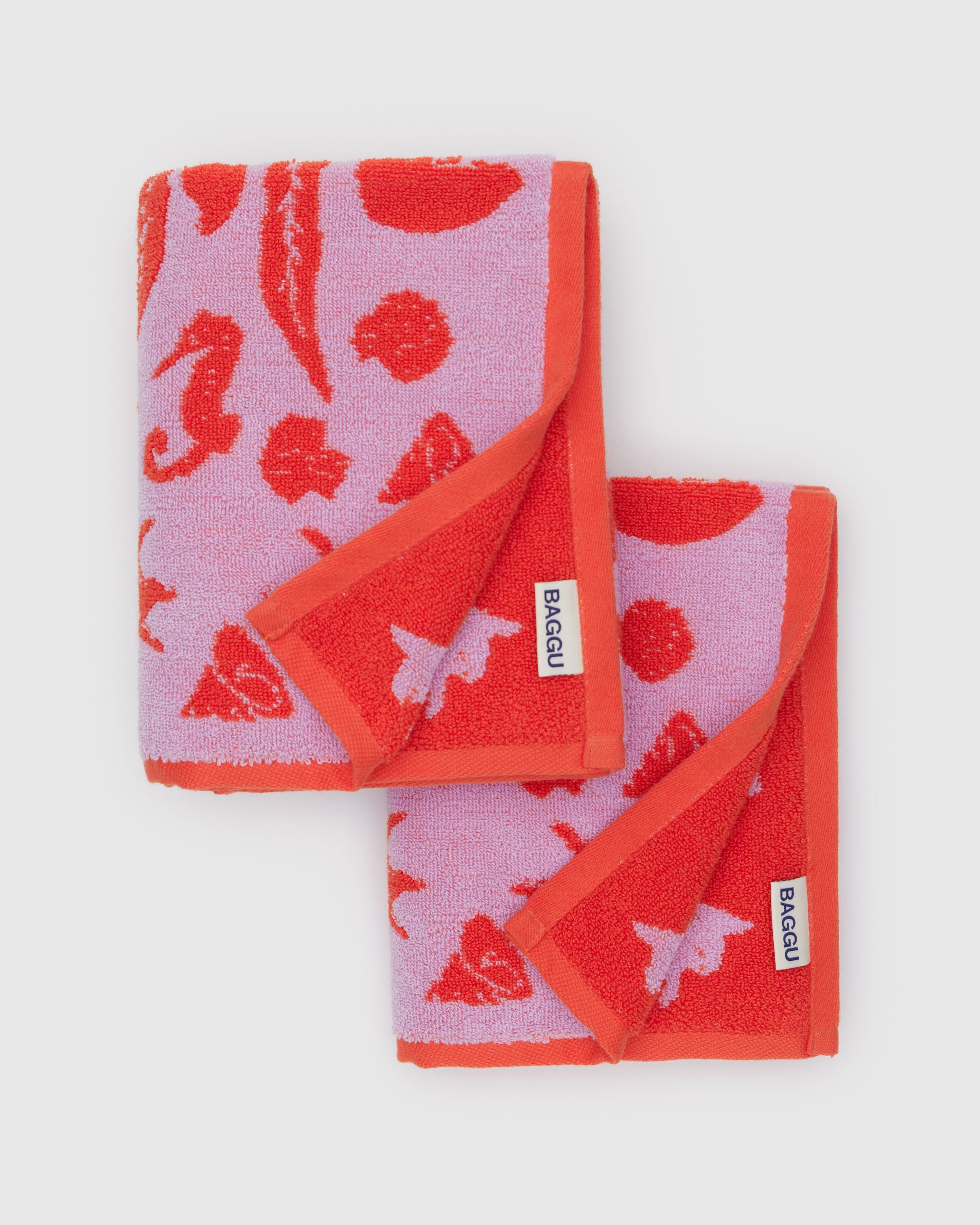 reversible-shell-pattern-on-hand-towels-set-of-two-red-and-pink-baggu-logo