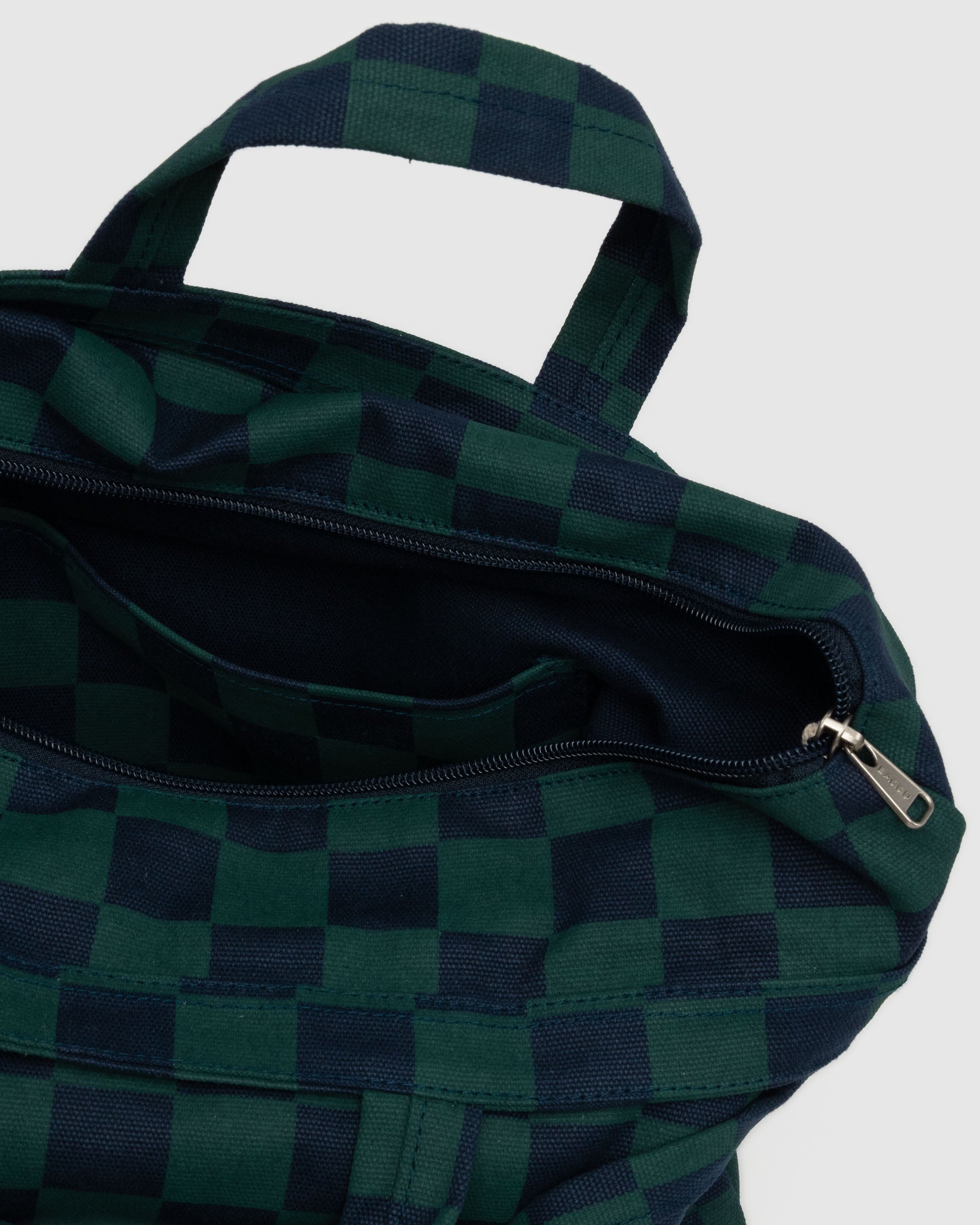 wide-canvas-tote-navy-green-check-bag-top-zip-open-with-pocket-inside-and-short-carry-handles-plus-long-adjustable-shoulder-strap