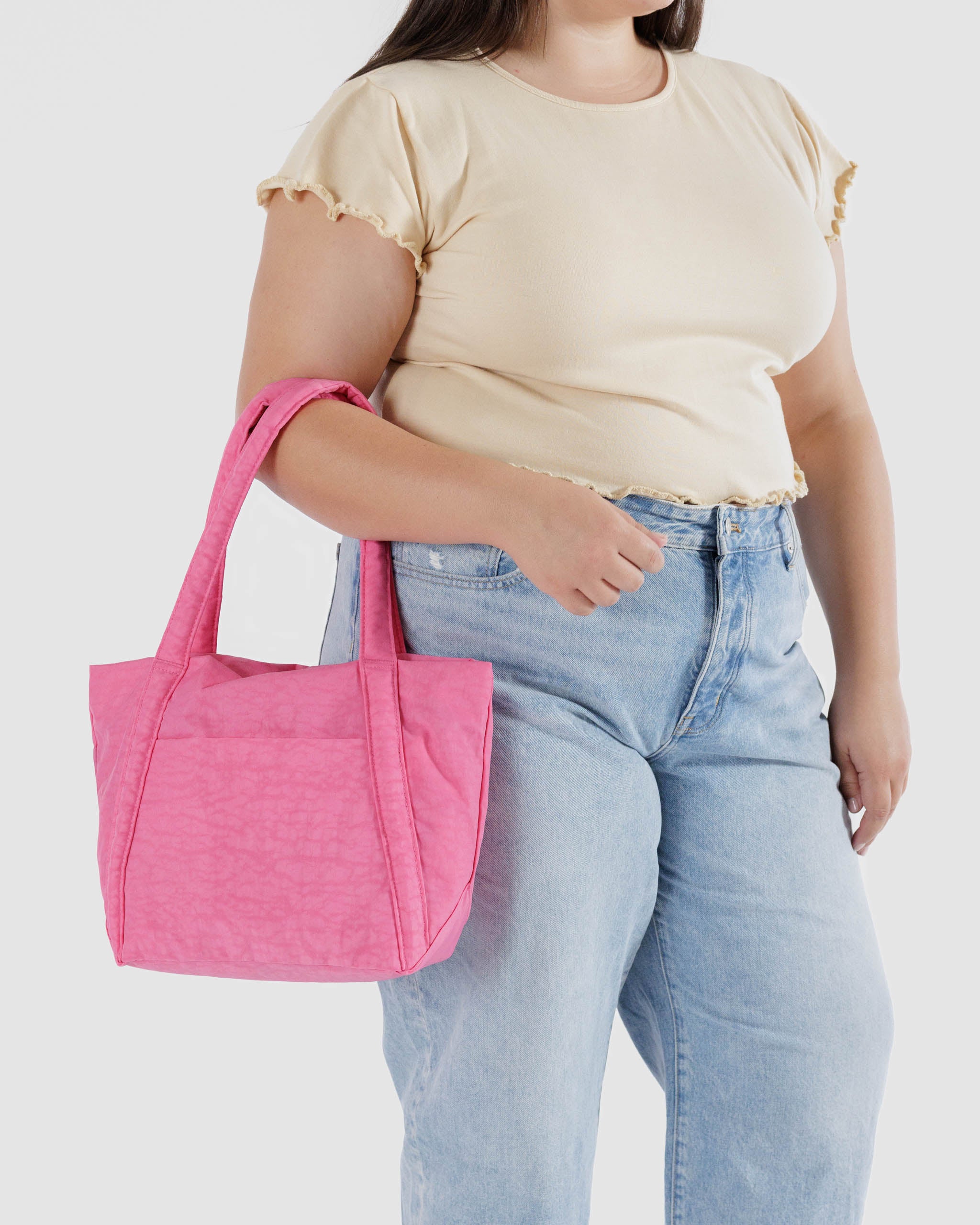women-holding-azalea-pink-mini-cloud-bag-on arm