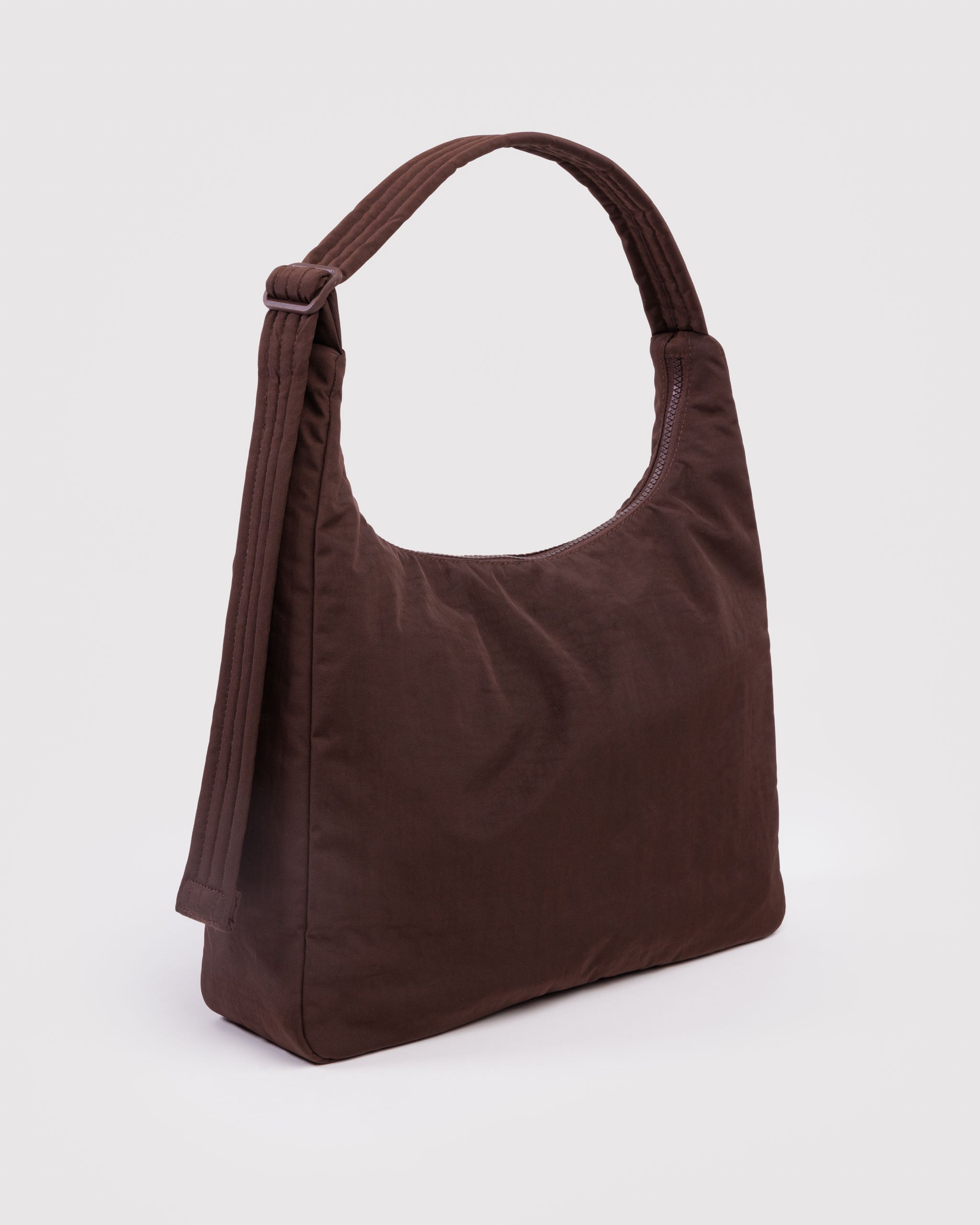 Brown shoulder bag with adjustable strap.
