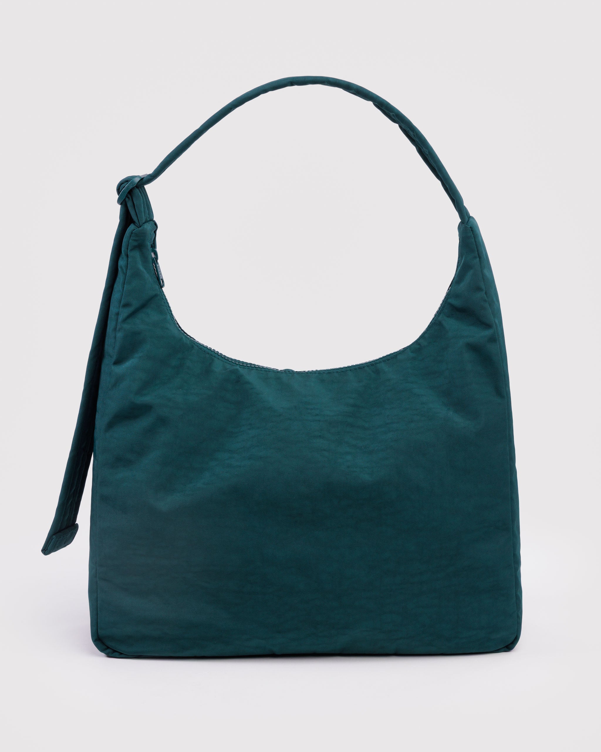 Green handbag with adjustable strap.