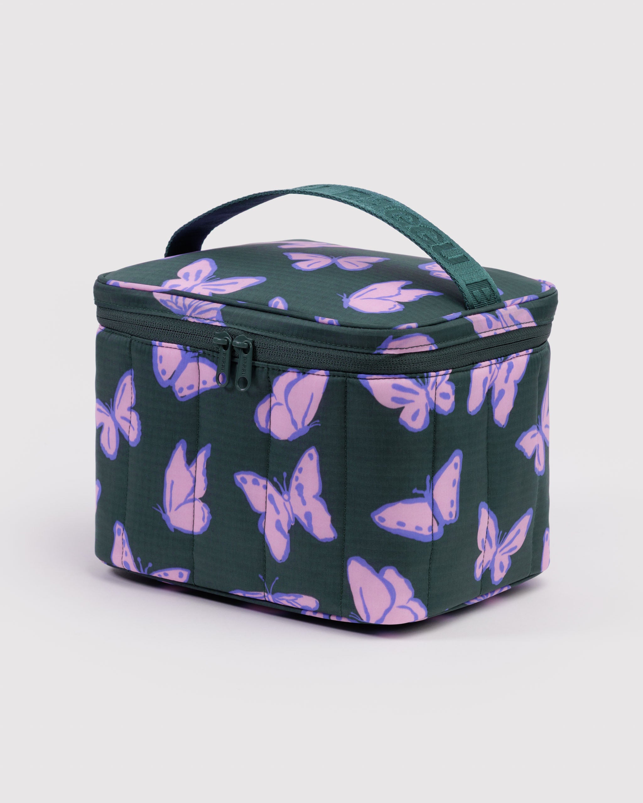 Green quilted and puffy lunch bag with purple butterfly pattern, zip closure and carry handle.