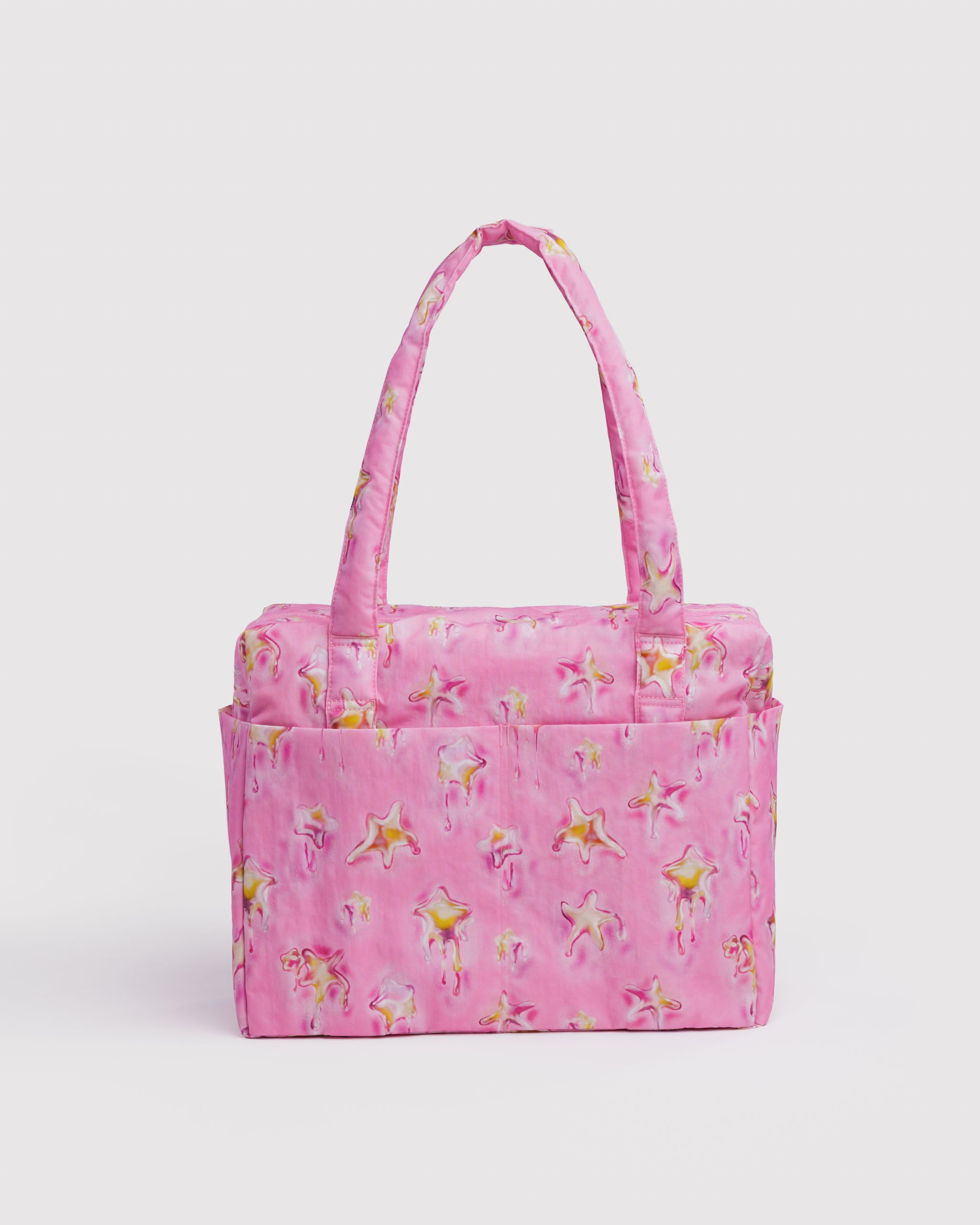 Pink dancing star-patterned duffle bag with shoulder straps, double top zippers and external slip pockets