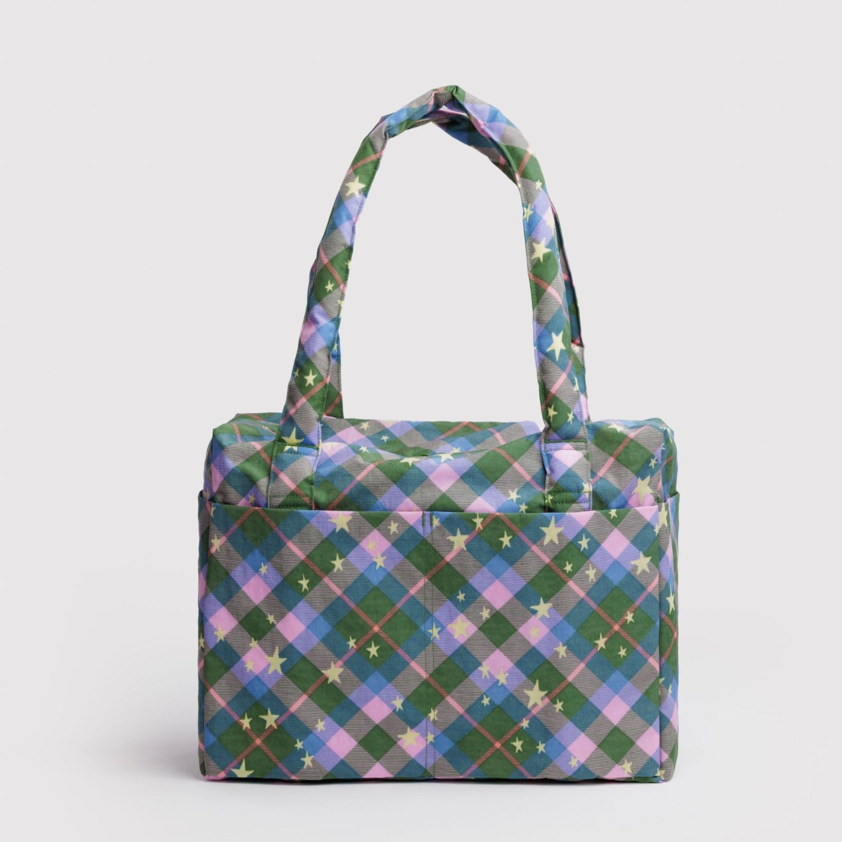 Green plaid duffle bag with star patterns, carry handles and zip top with outside deep pockets.