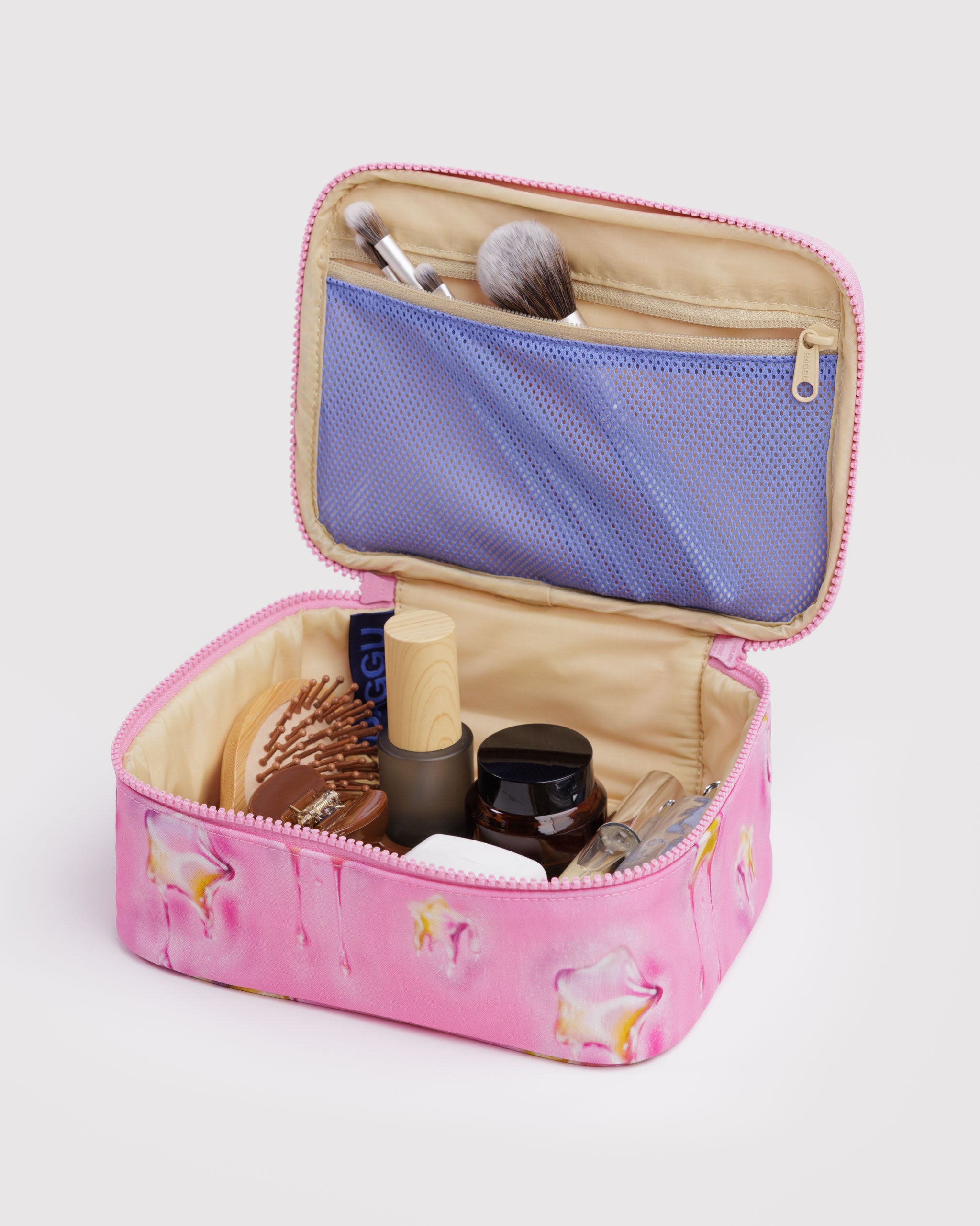 Pink cosmetic bag with makeup items