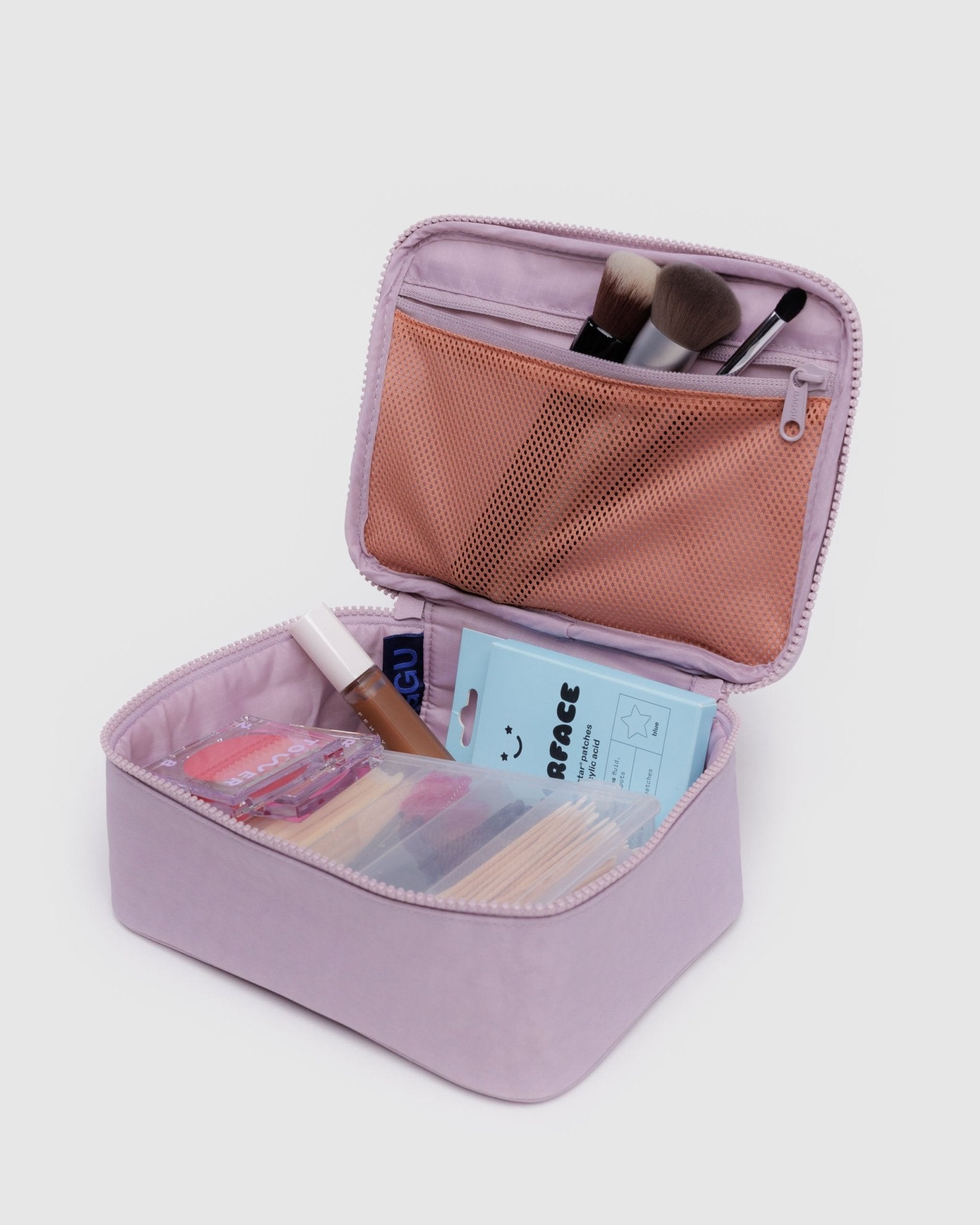 Dusty pink small cosmetic case with lid open showing mesh zip pocket with brushes and other contents inside - ANNIE.G