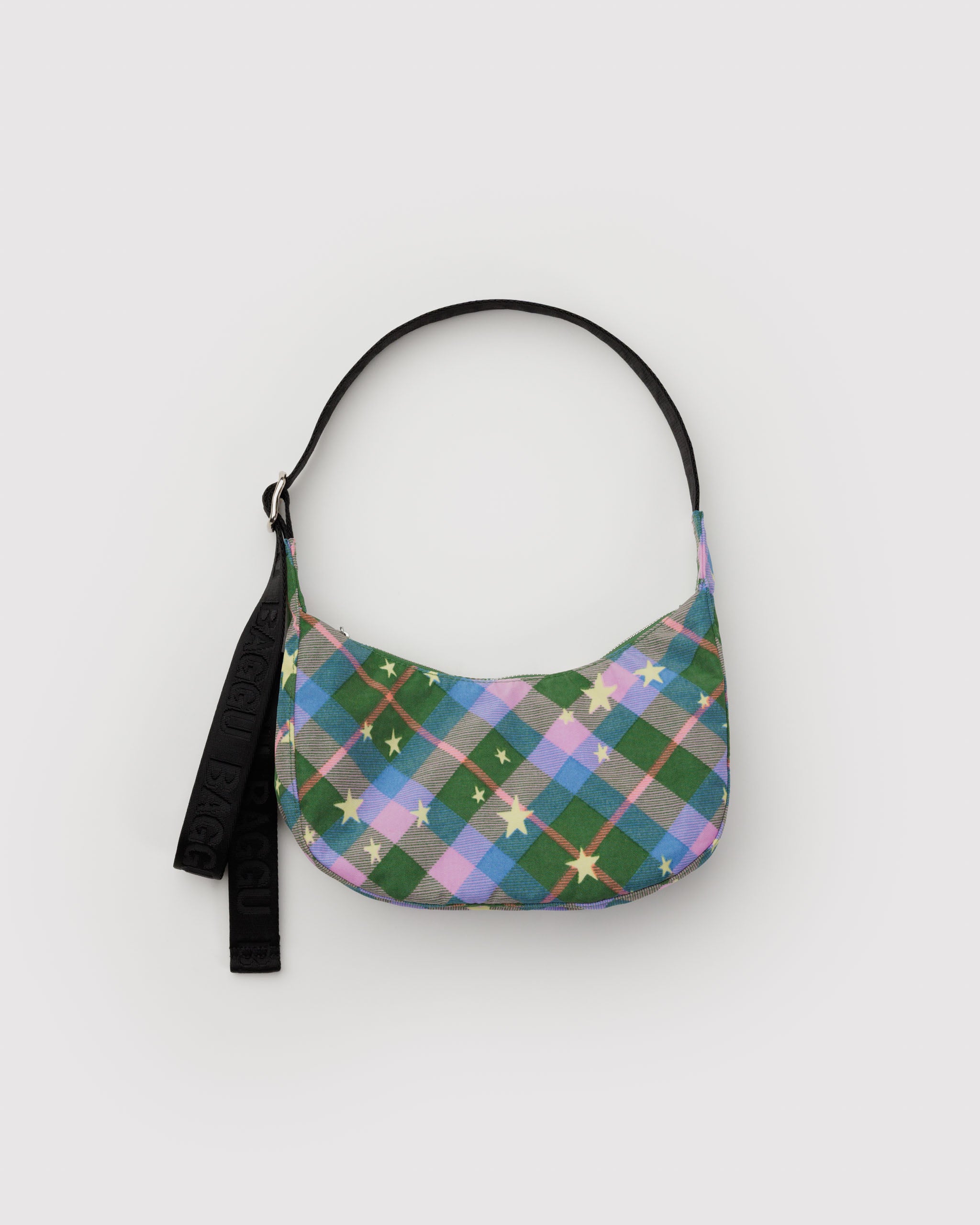 Green Plaid with stars patterned bag and a black adjustable strap.