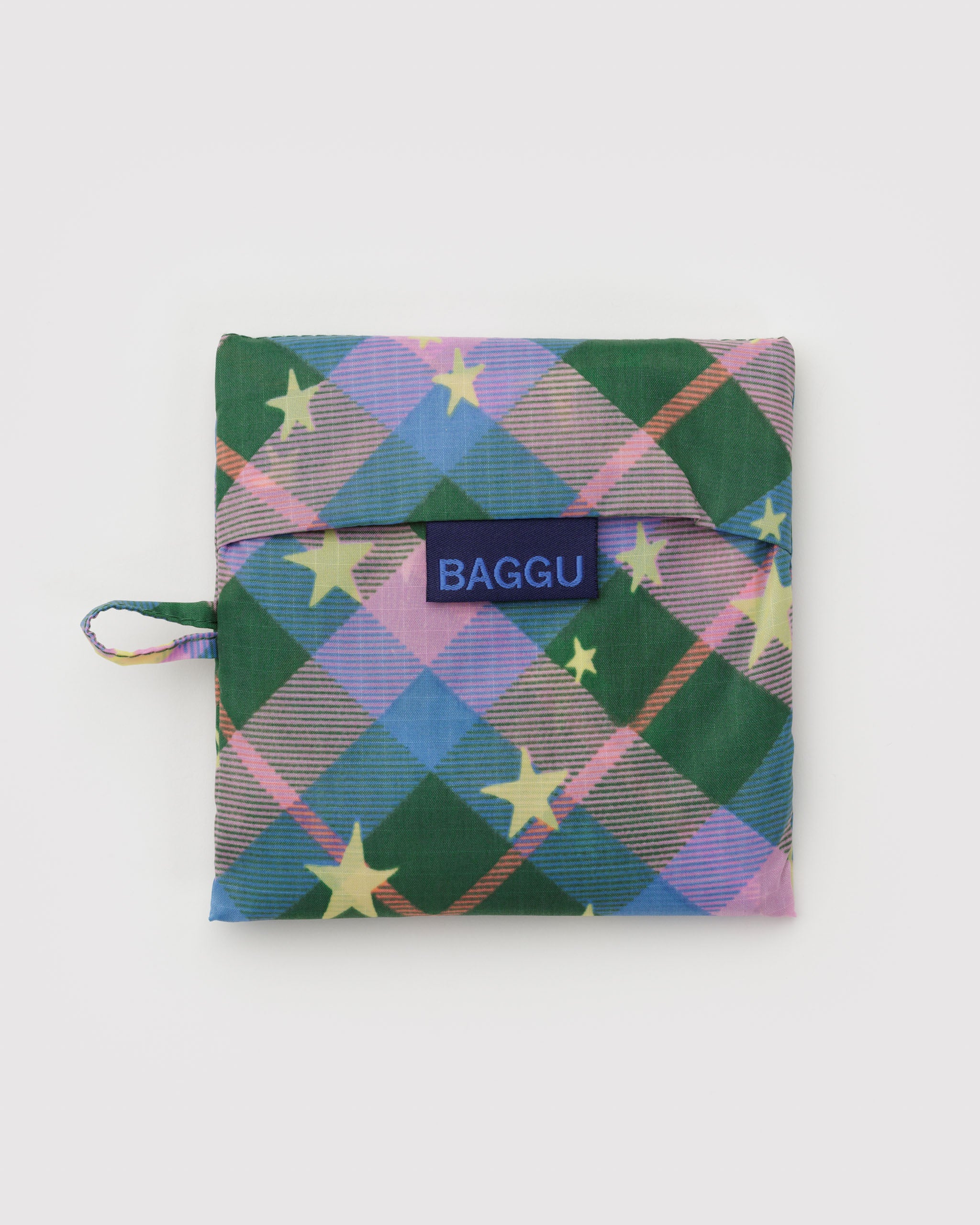 Multicolored green plaid pouch with star patterns, a hanging loop and blue 'BAGGU' branding label.