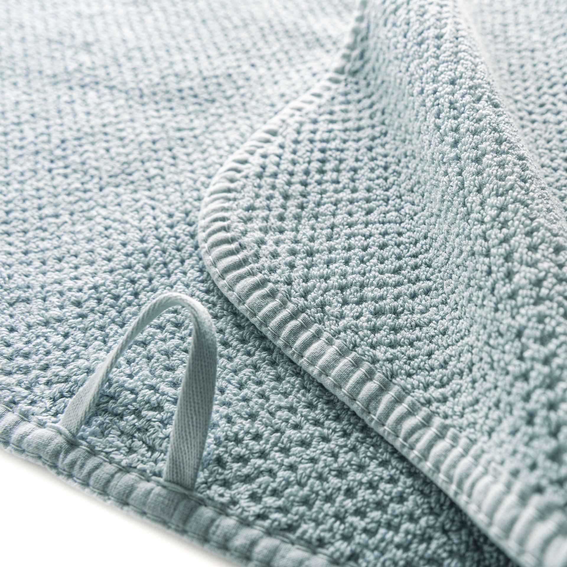 Close up of hanging loop on light green AG Waffle Sports Towel - ANNIE.G