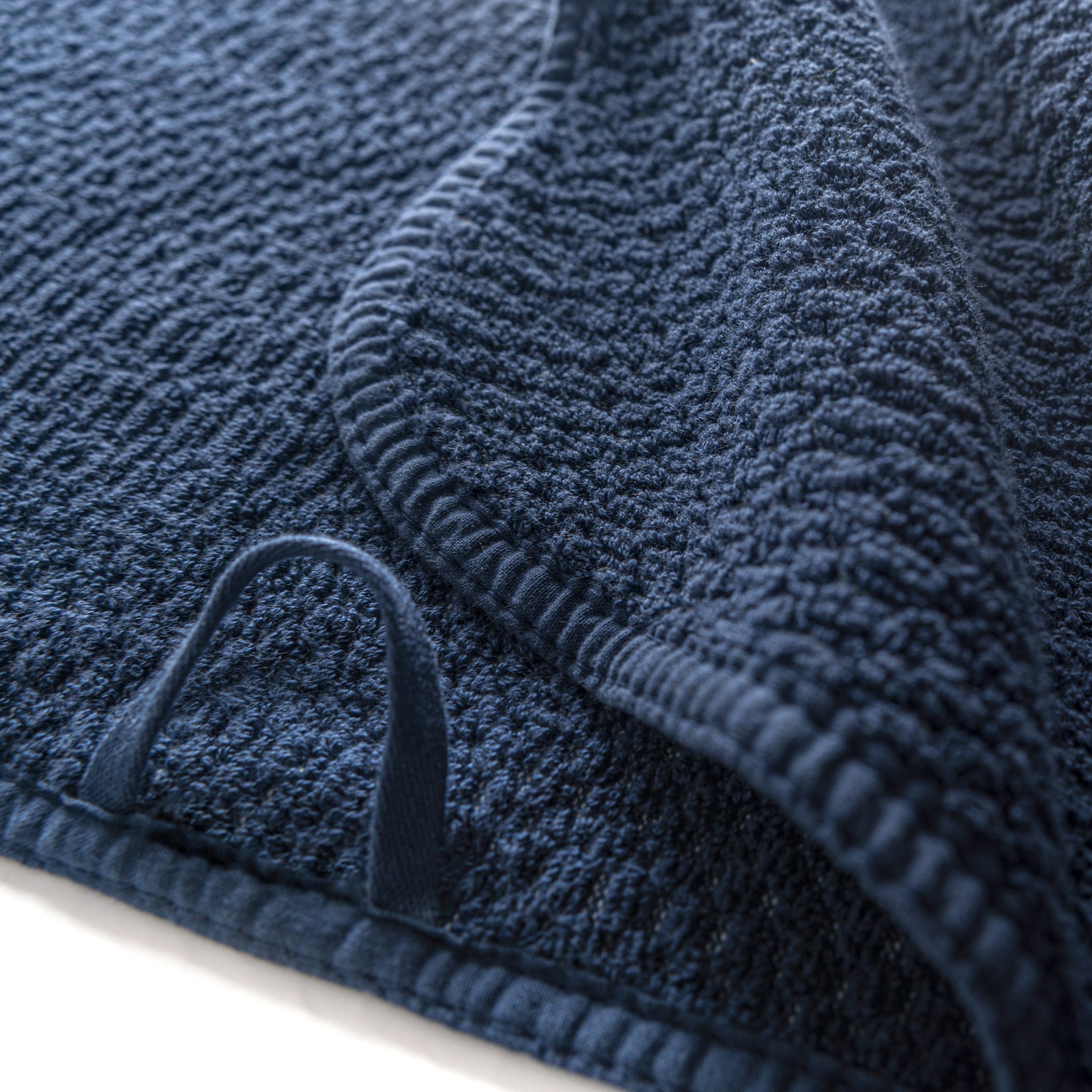 Close up of hanging loop on sports towel.