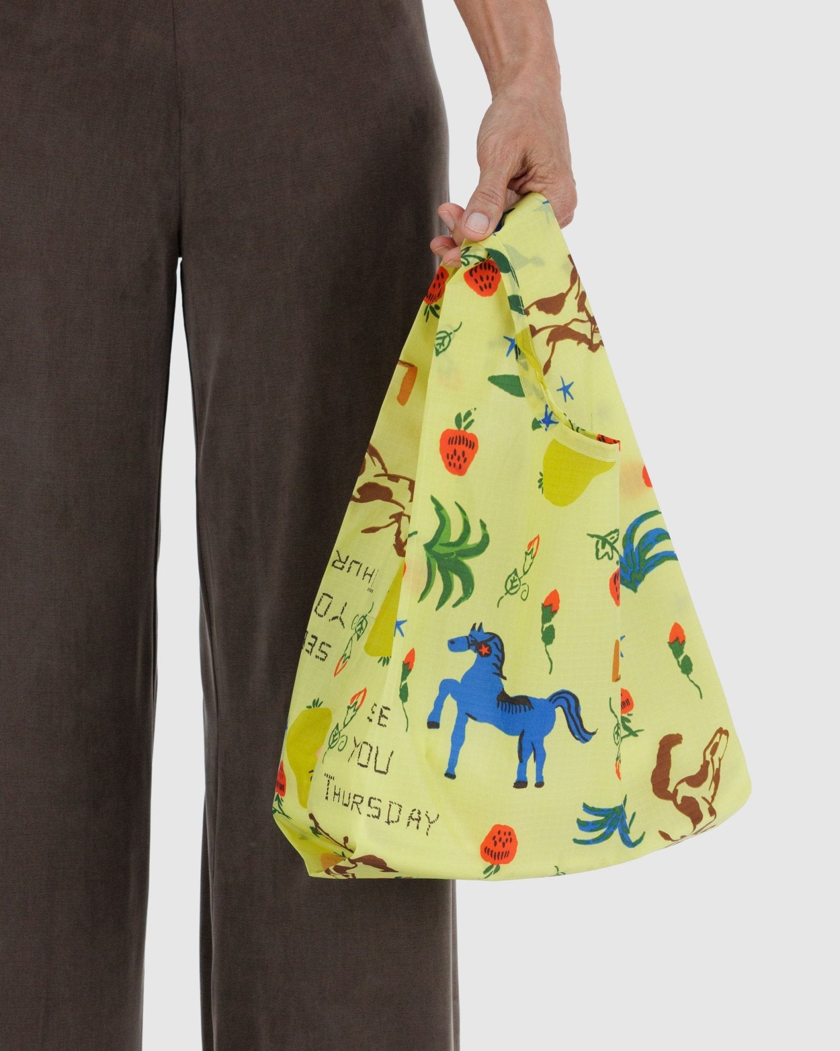 Light yellow with prairie and horse prints Baggu Baby Baggu Reusable Shopping tote Bag.