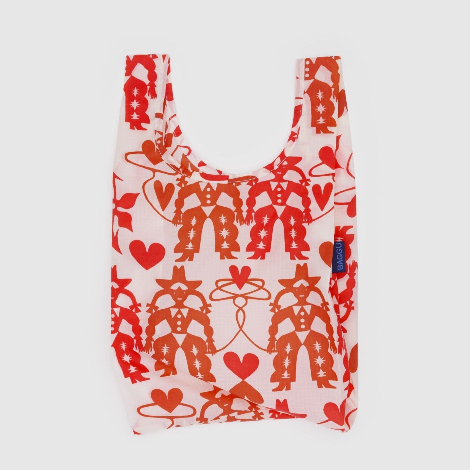 Baby size reusable shopping bag with red cowgirl and heart patterns and BAGGU tag on the side