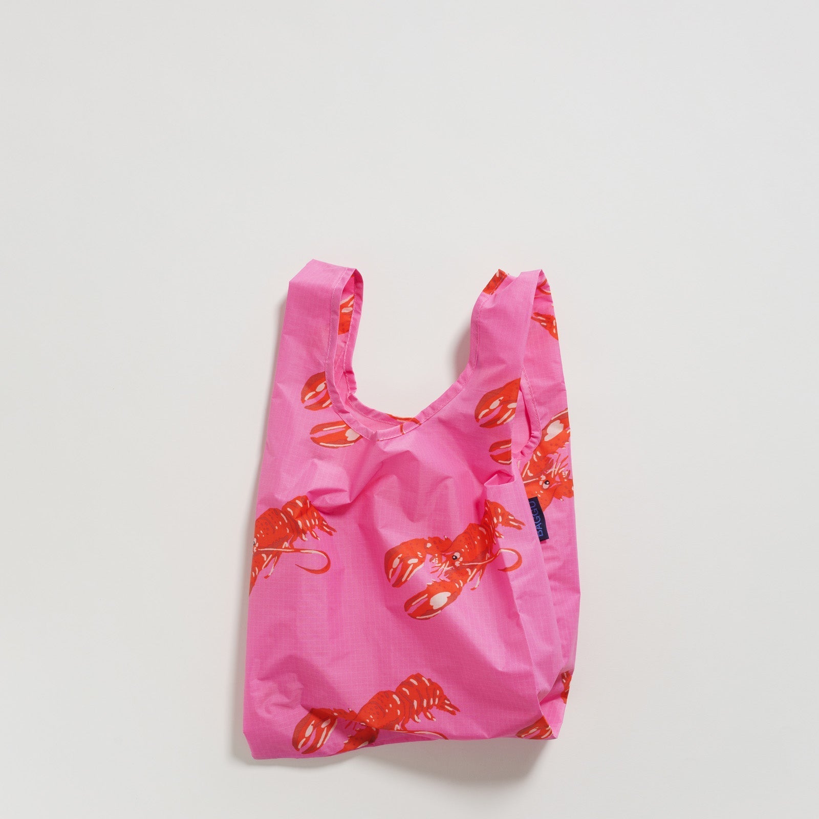 Pink with red lobster print reusable tote bag.