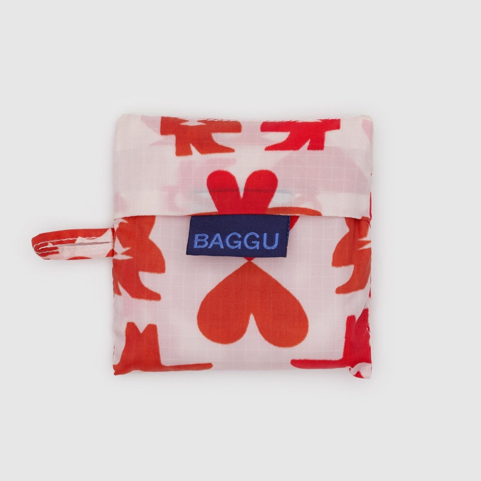 Pink baby size reusable bag pouch with red cowgirl and heart pattern, 'BAGGU' logo tag and loop