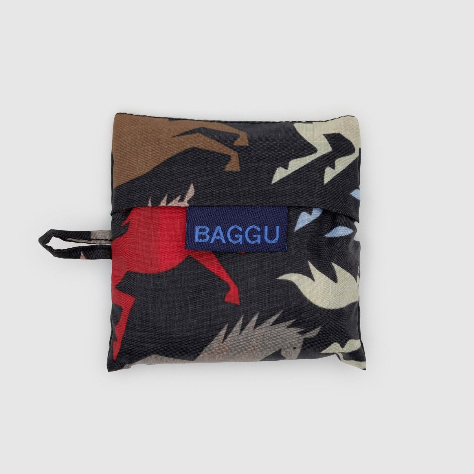 Folded black fabric bag with a coloured horse pattern and 'BAGGU' logo and hanging loop