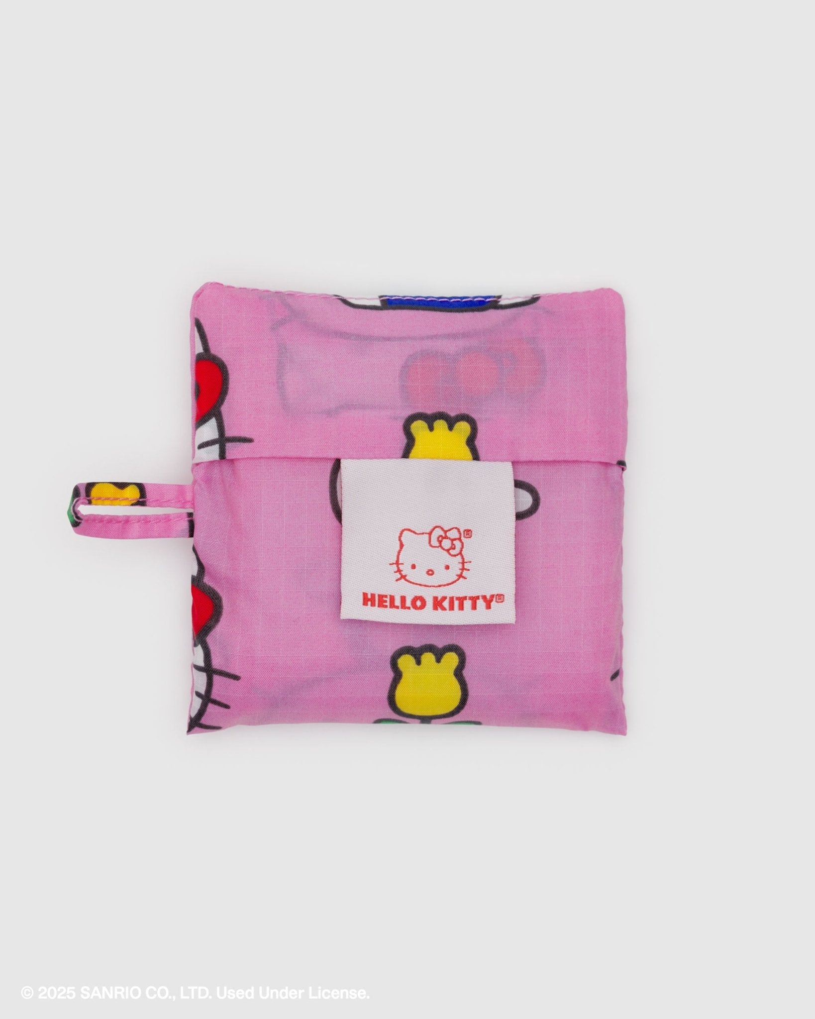 Pink Hello Kitty storage pouch for a baby baggu with a white tag and loop at side