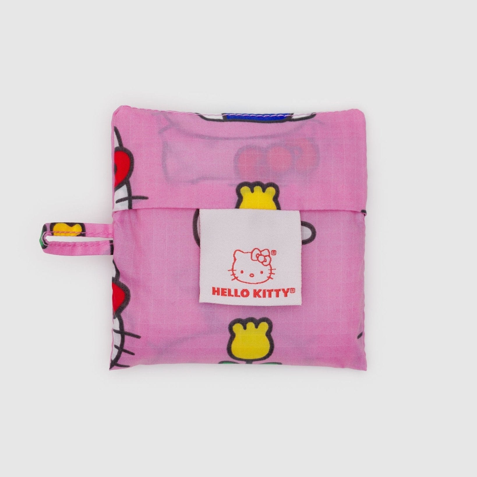 Pink Hello Kitty storage pouch for a baby baggu with a white tag and loop at side