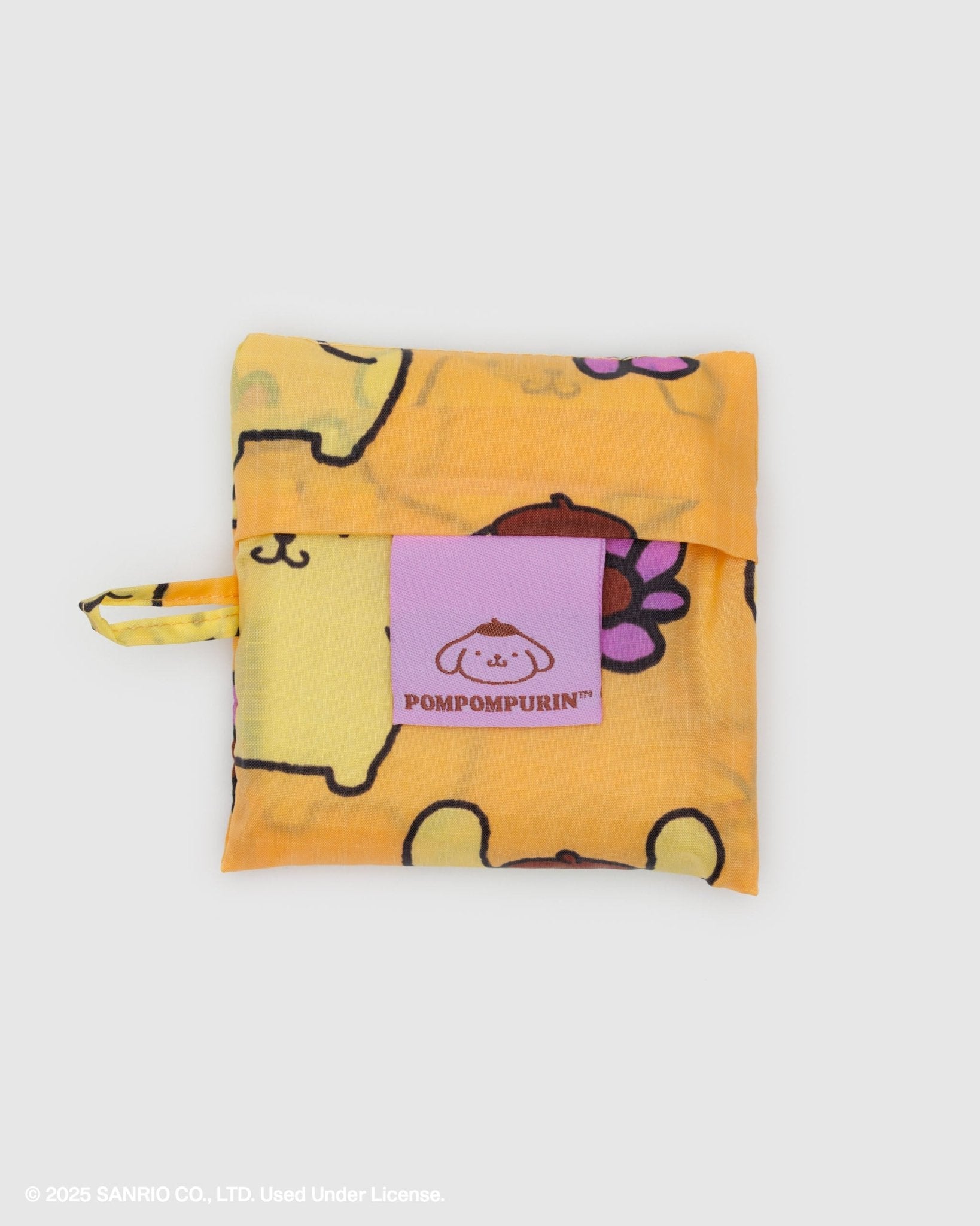 Yellow storage pouch with golden dog cartoon character design and Pompompurin logo and loop at side
