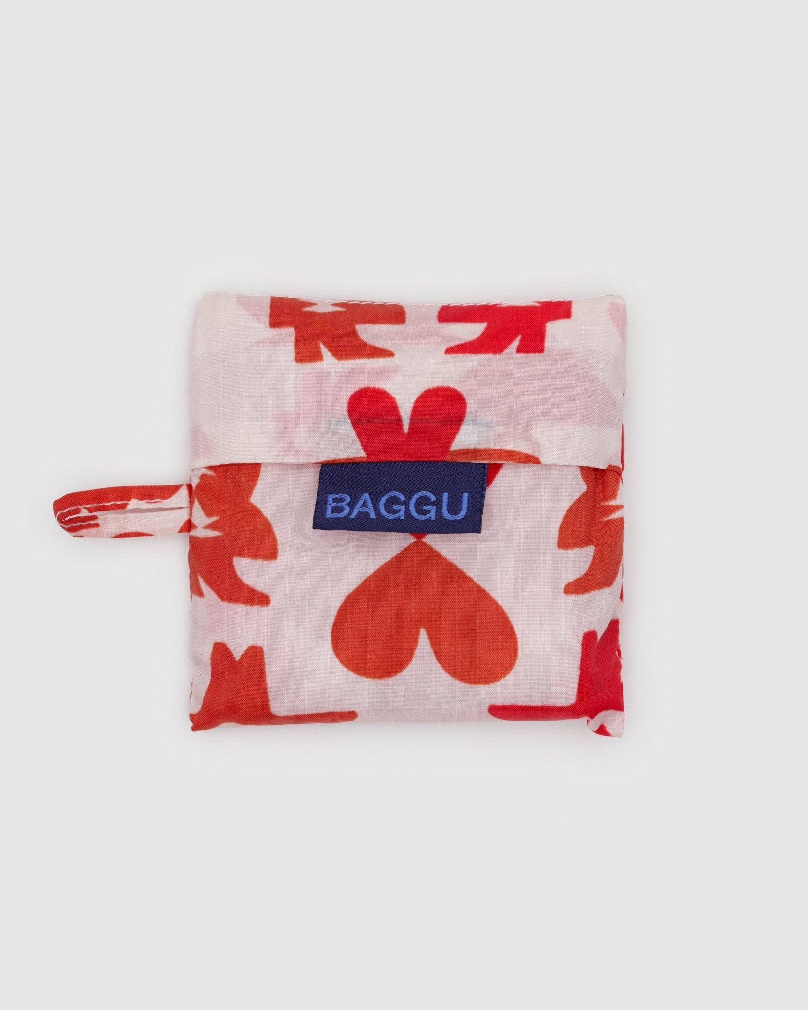 Pink baby size reusable bag pouch with red cowgirl and heart pattern, 'BAGGU' logo tag and loop