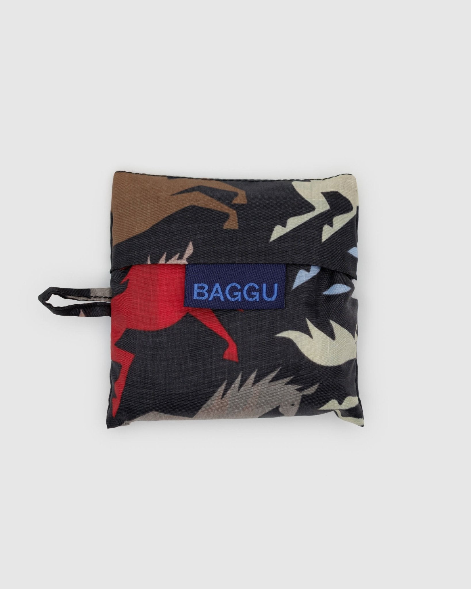 Folded black fabric bag with a coloured horse pattern and 'BAGGU' logo and hanging loop