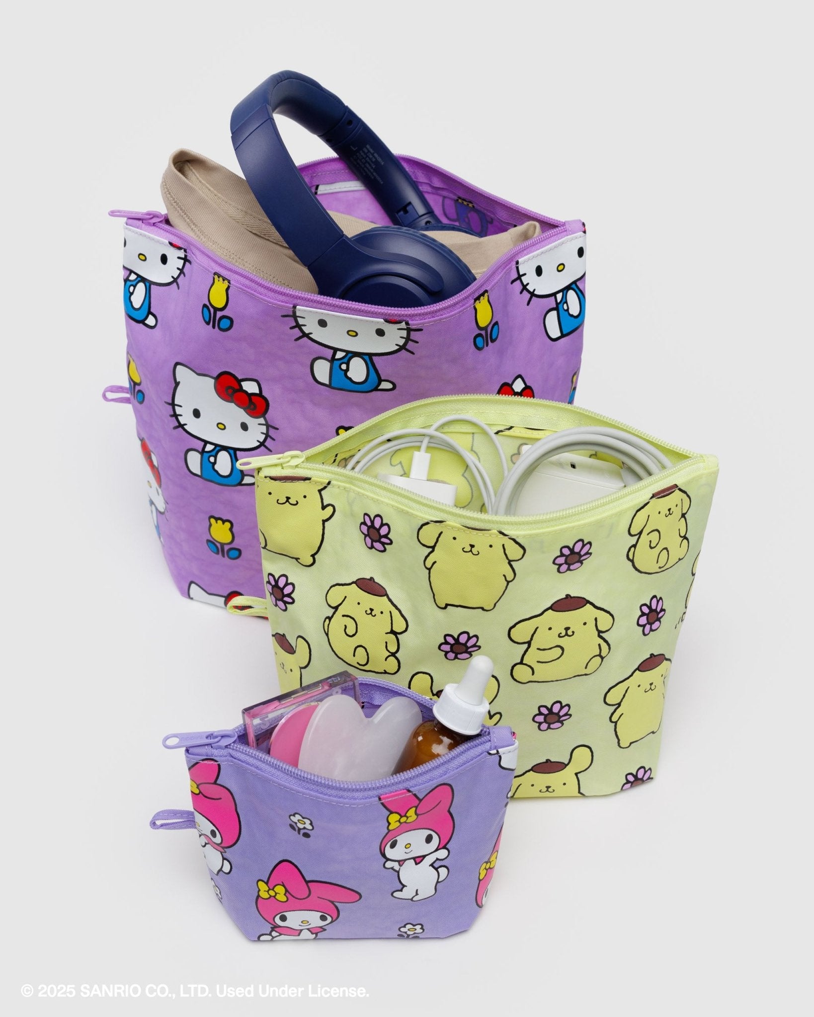 Set of three different size pouches with cartoon character patterns, expandable bottoms and top zips