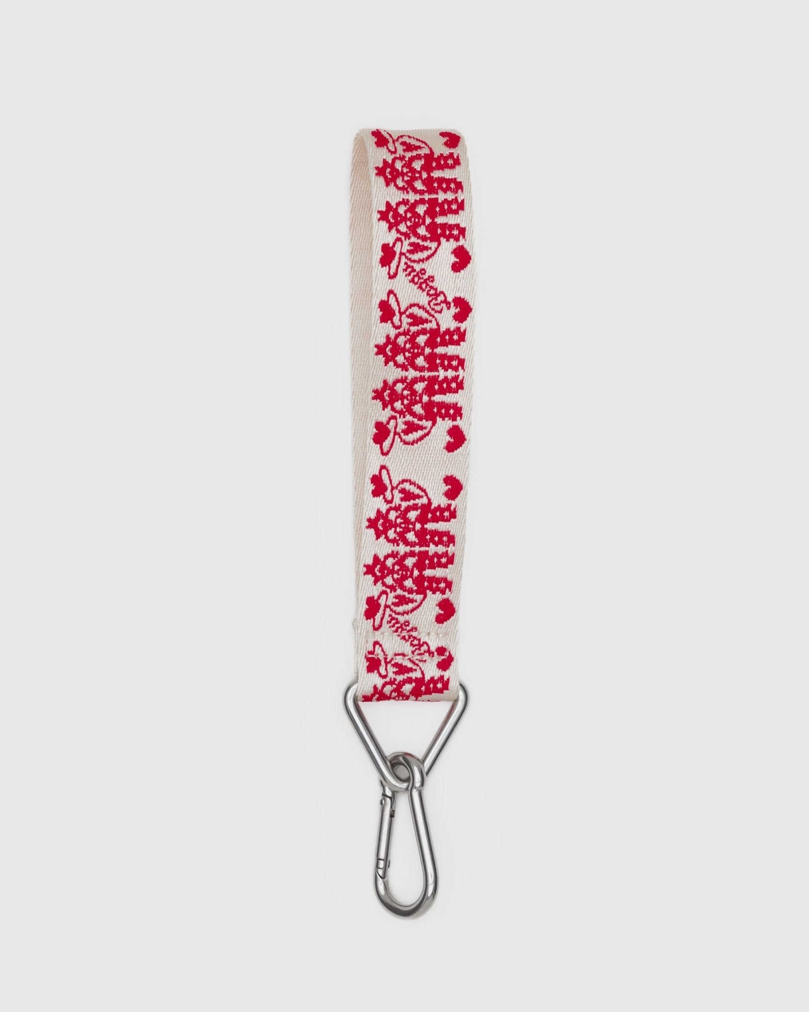 White keychain with red cowgirl pattern and metal clip