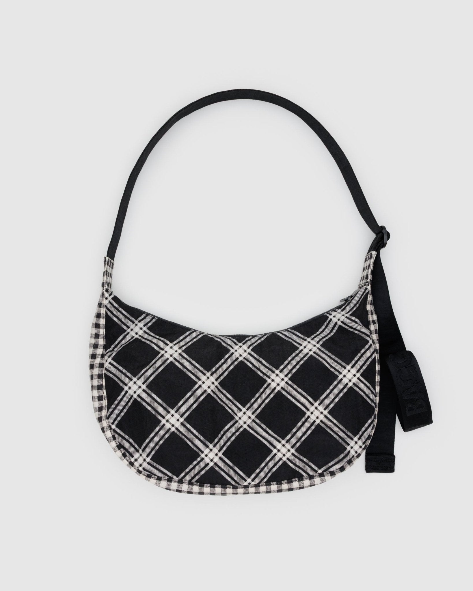 Black and white checkered bag with a black adjustable strap