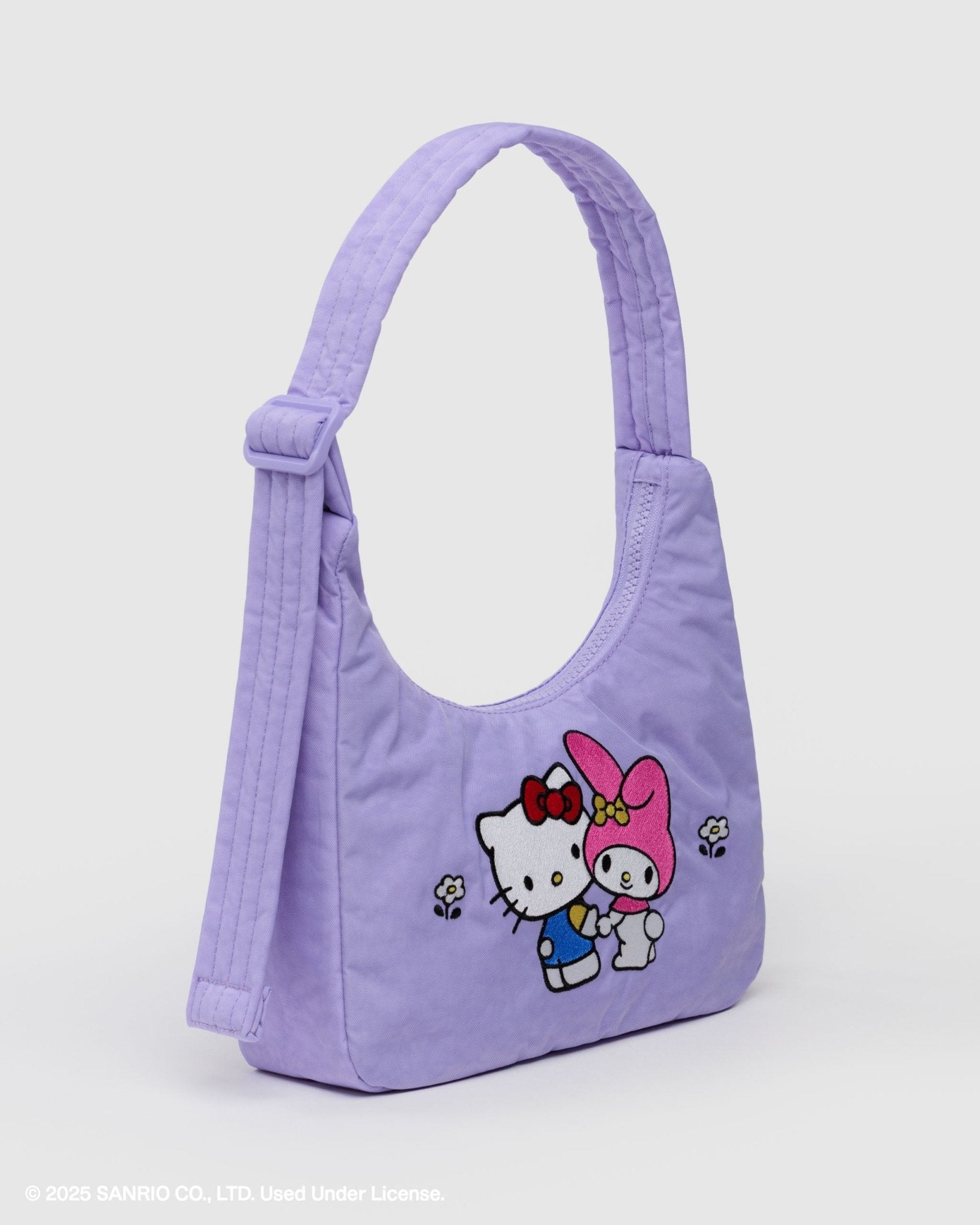 Purple shoulder handbag with cartoon characters on the front with a zip top and adjustable strap