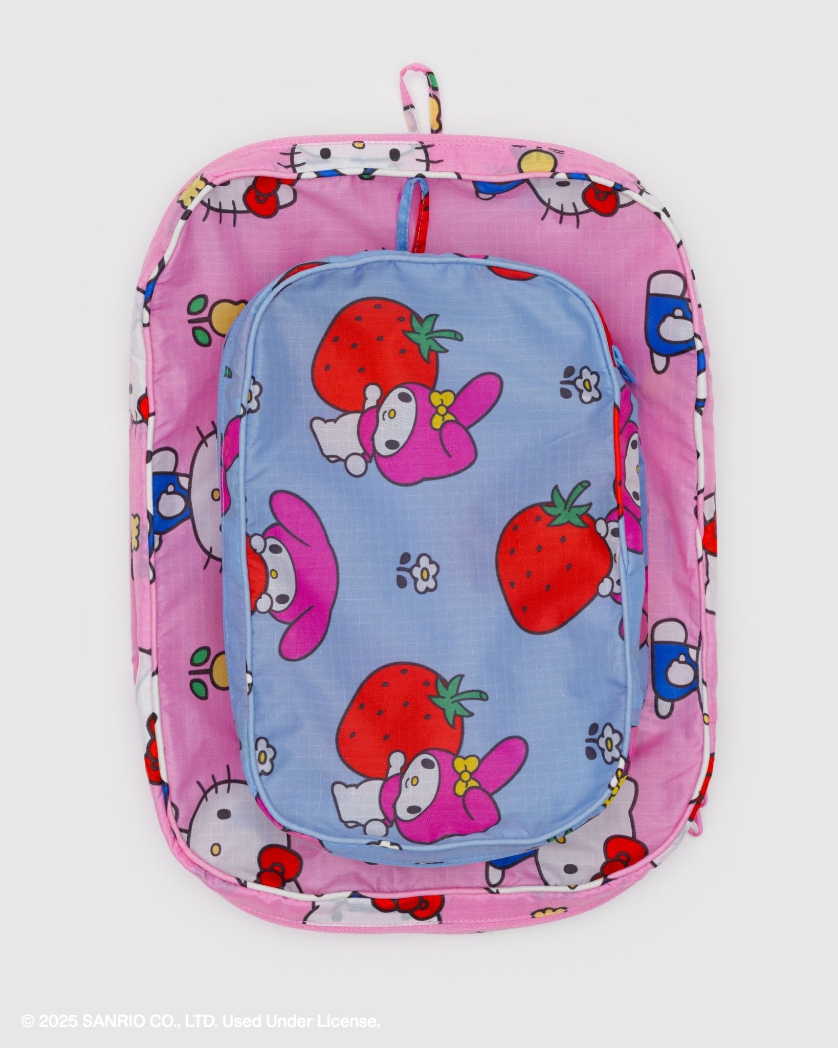 set of 2 pink and blue packing cubes with zips with hello kitty character and strawberry pattern