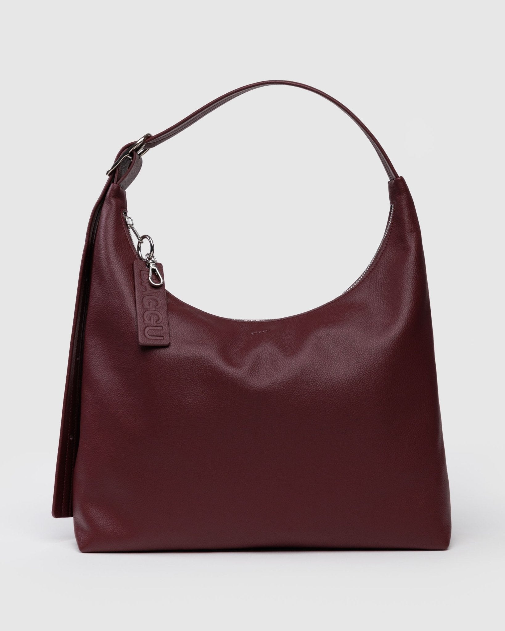 Burgandy/Maroon recycled leather handbag with adjustable shoulder strap, a visible brand tag and carabiner on zipper