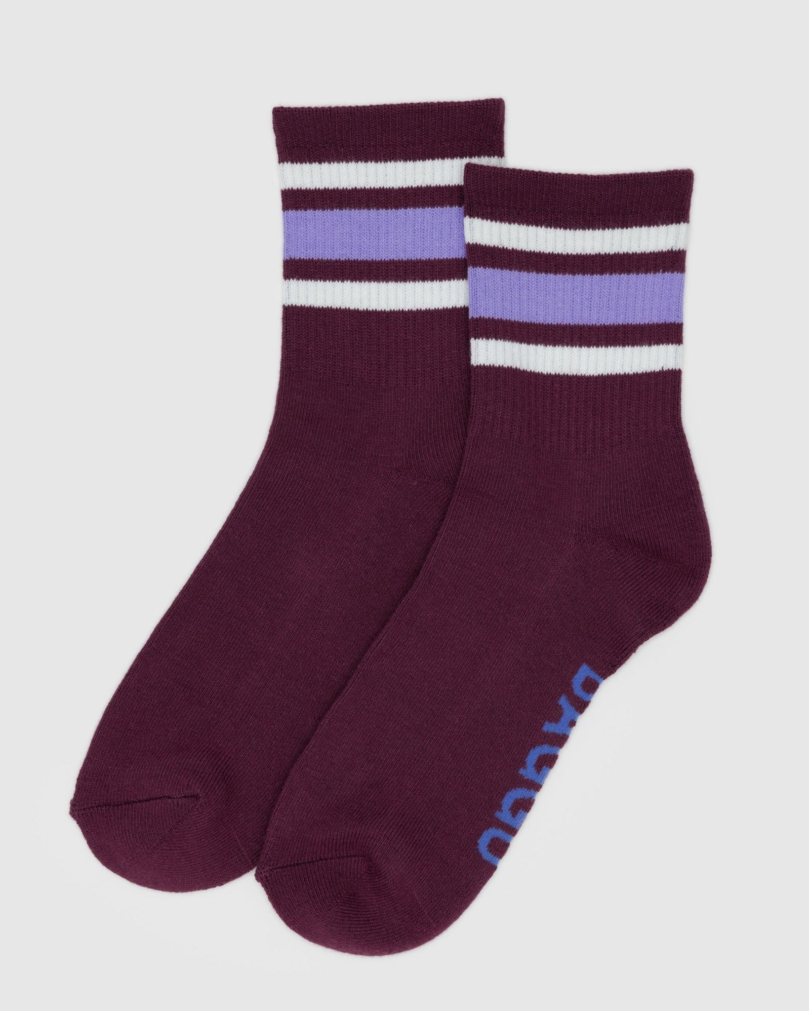 Pair of maroon socks with horizontal white and purple stripes and BAGGU brand on sole