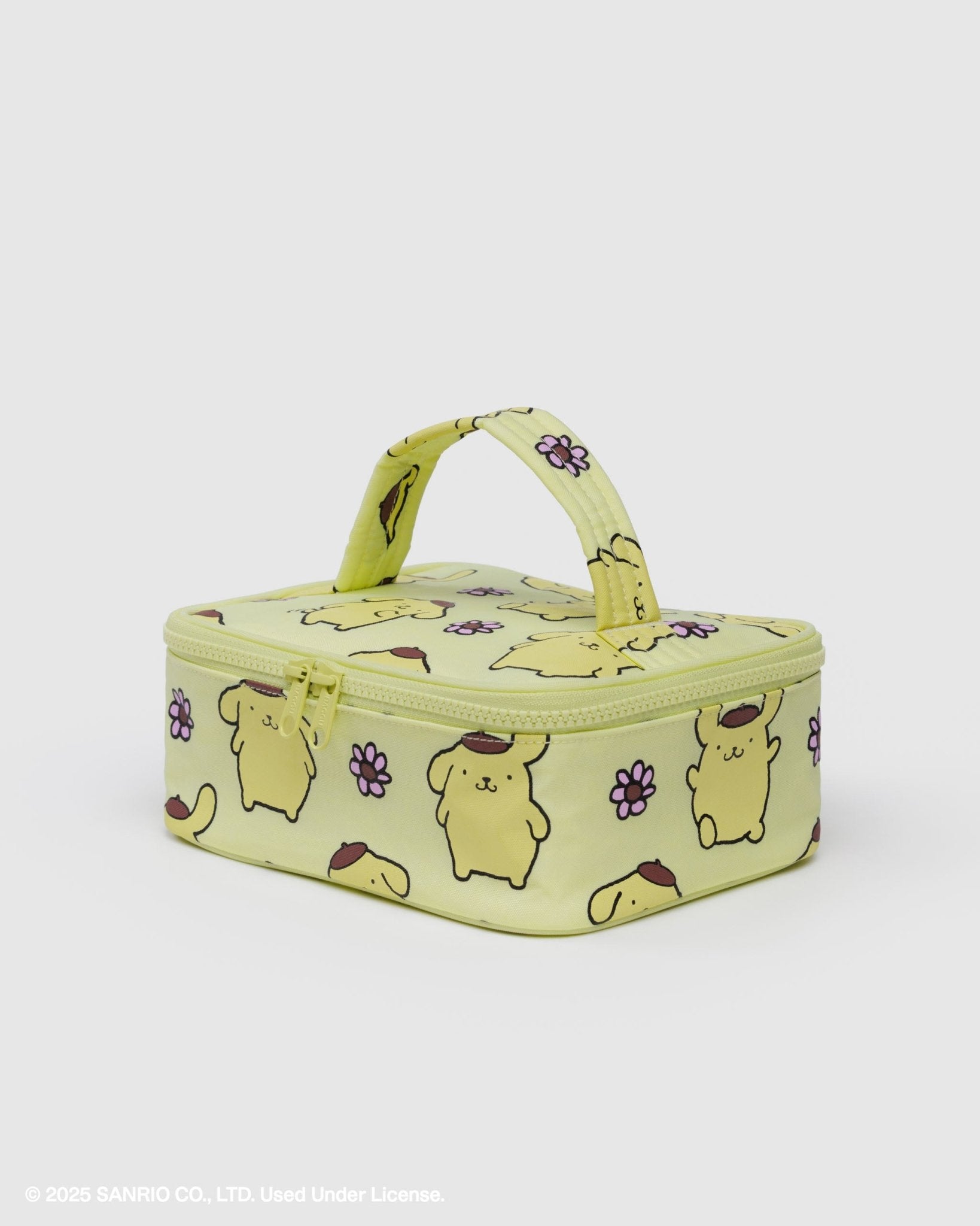 yellow small cosmetic case with zip top and quilted carry handle with print of a golden dog wearing a brown beret and pink flower pattern