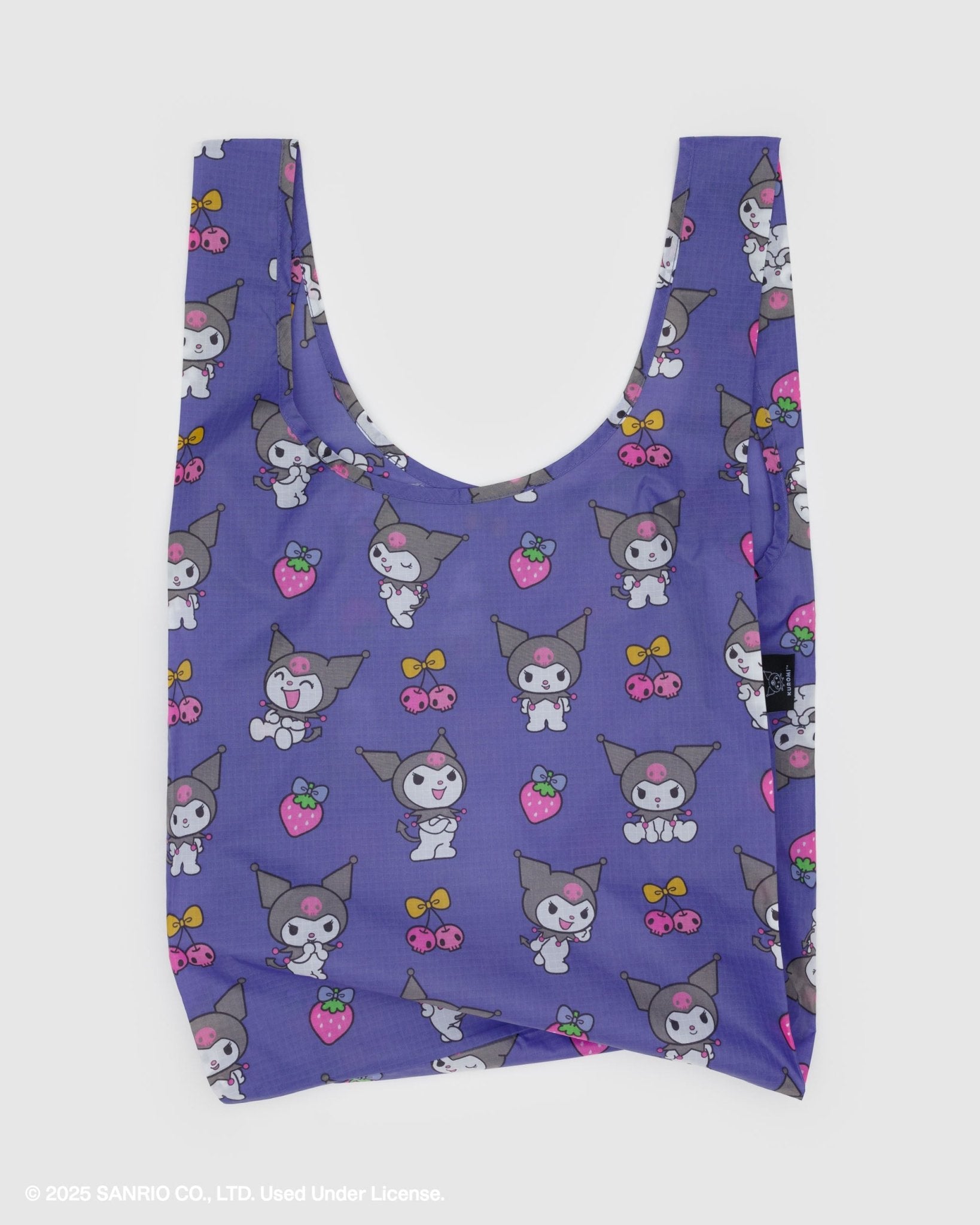 Purple reusable bag with print of a white rabbit with black devil tail and jester hat, a strawberry and cherry pattern