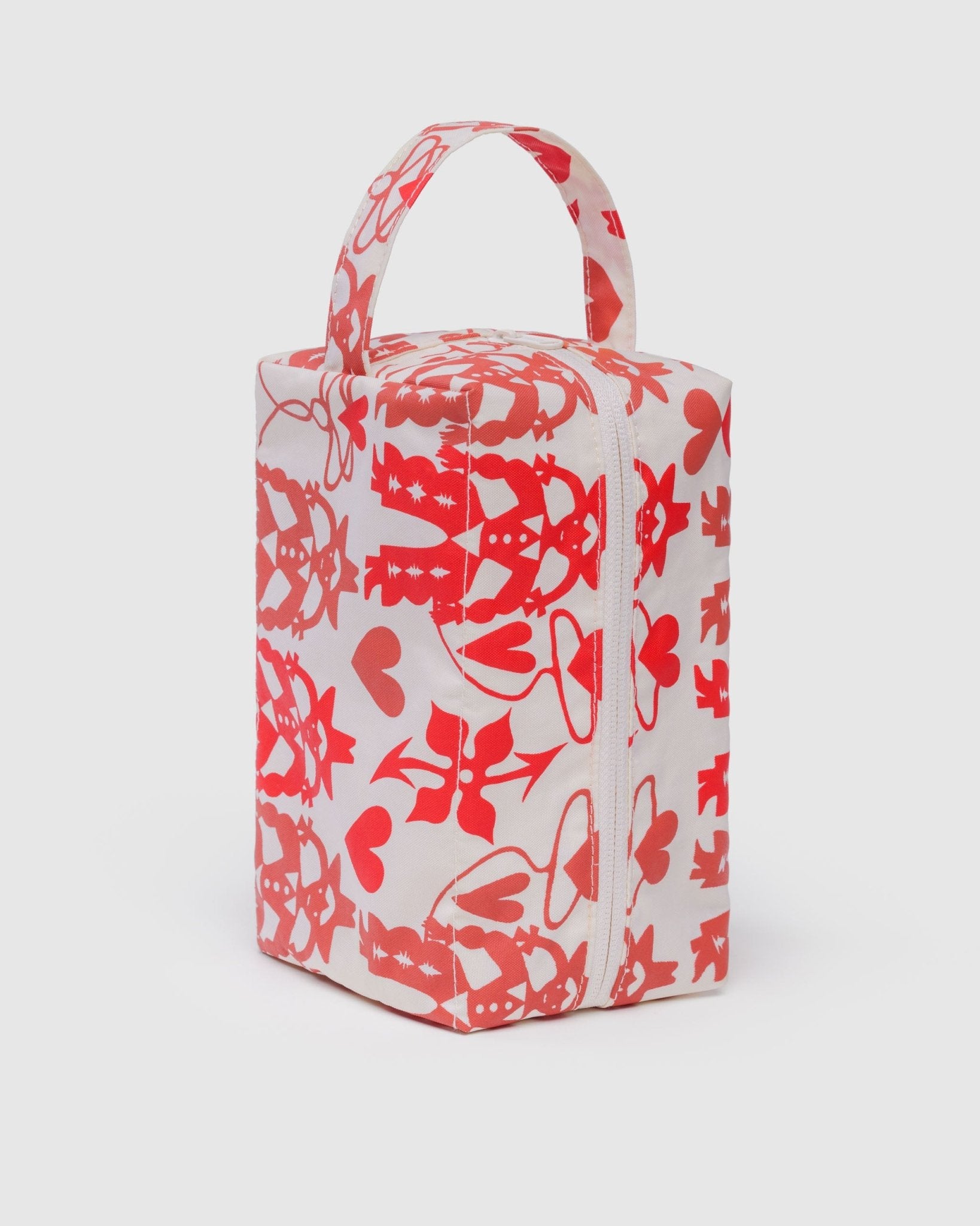 Rectangular bag with red cowgirl pattern on a white background and carry handle and zip top.