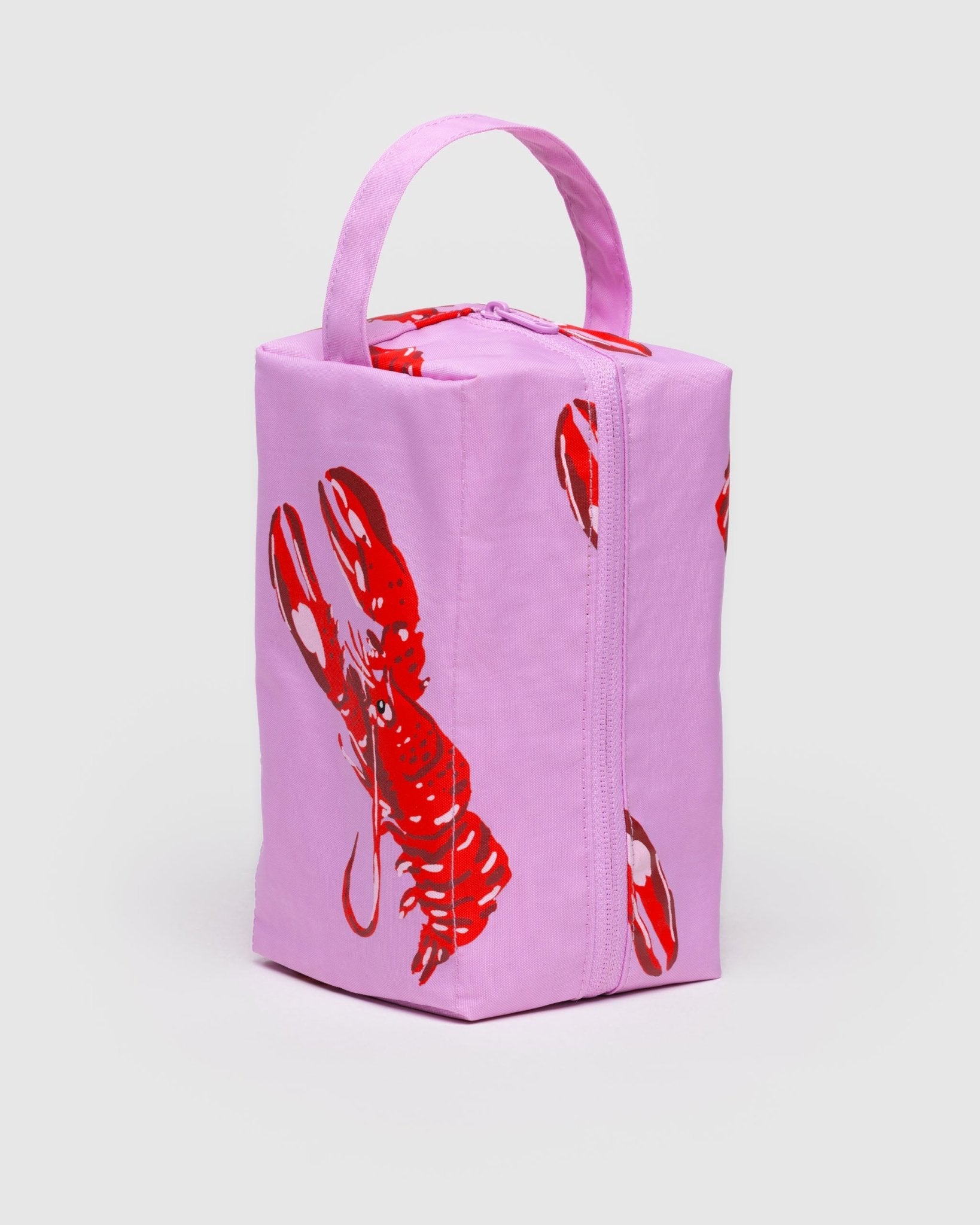 Pink rectangular bag with red lobster design with top zip and carry handle.