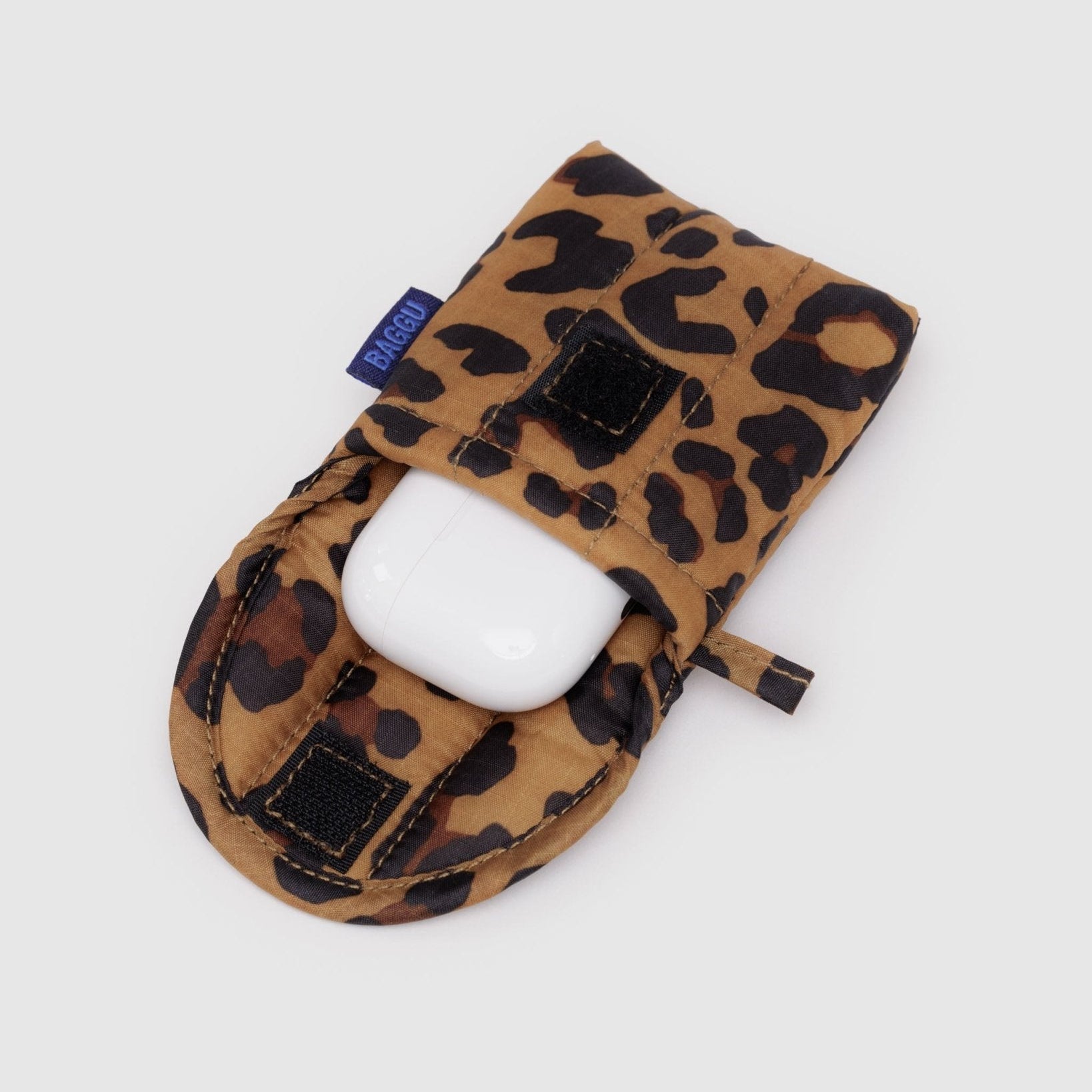 White plastic earbuds case inside leopard print Baggu Puffy Earbuds Case with velcro closure - ANNIE.G
