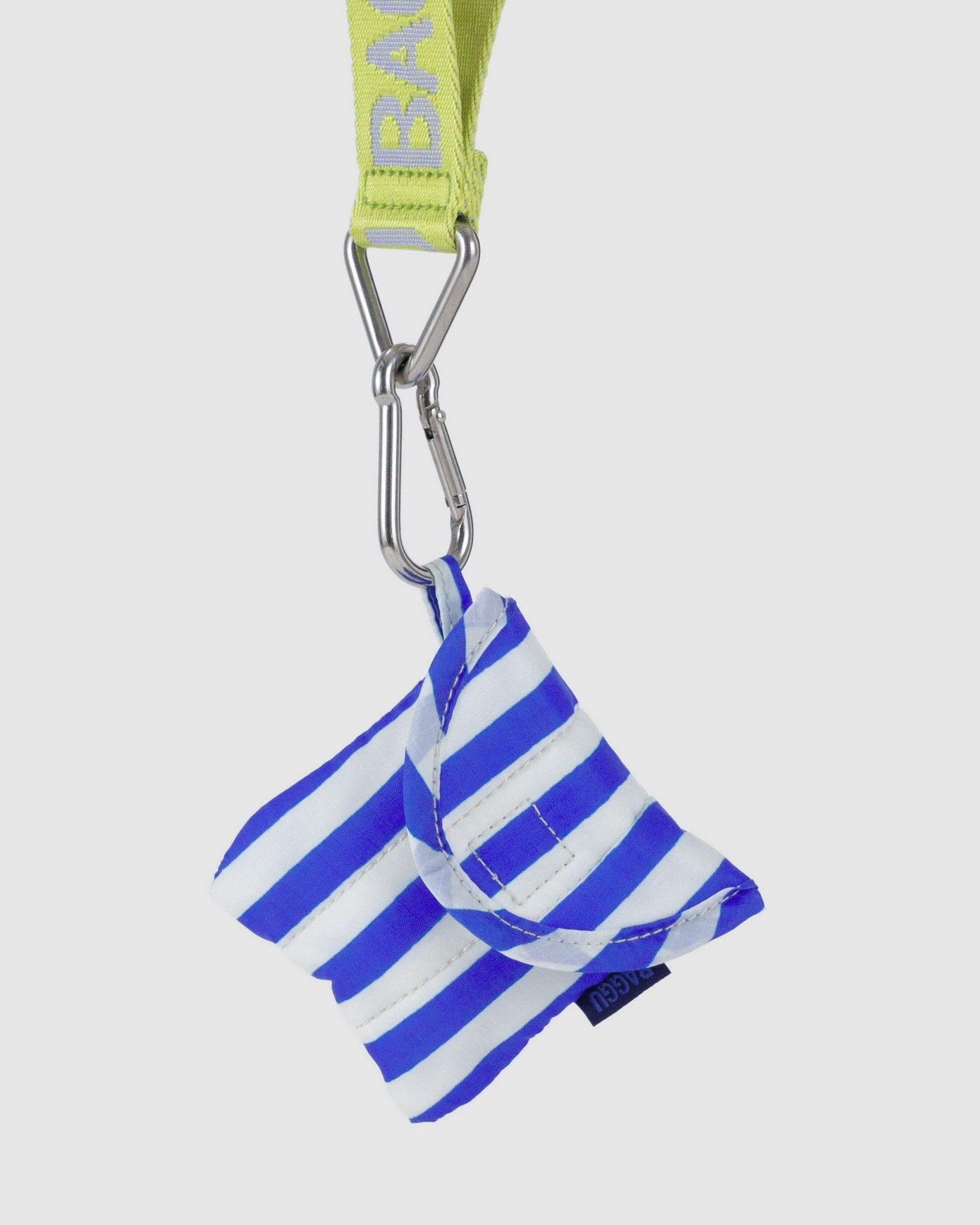 Puffy earbuds case in blue stripe hanging from hanging loop.