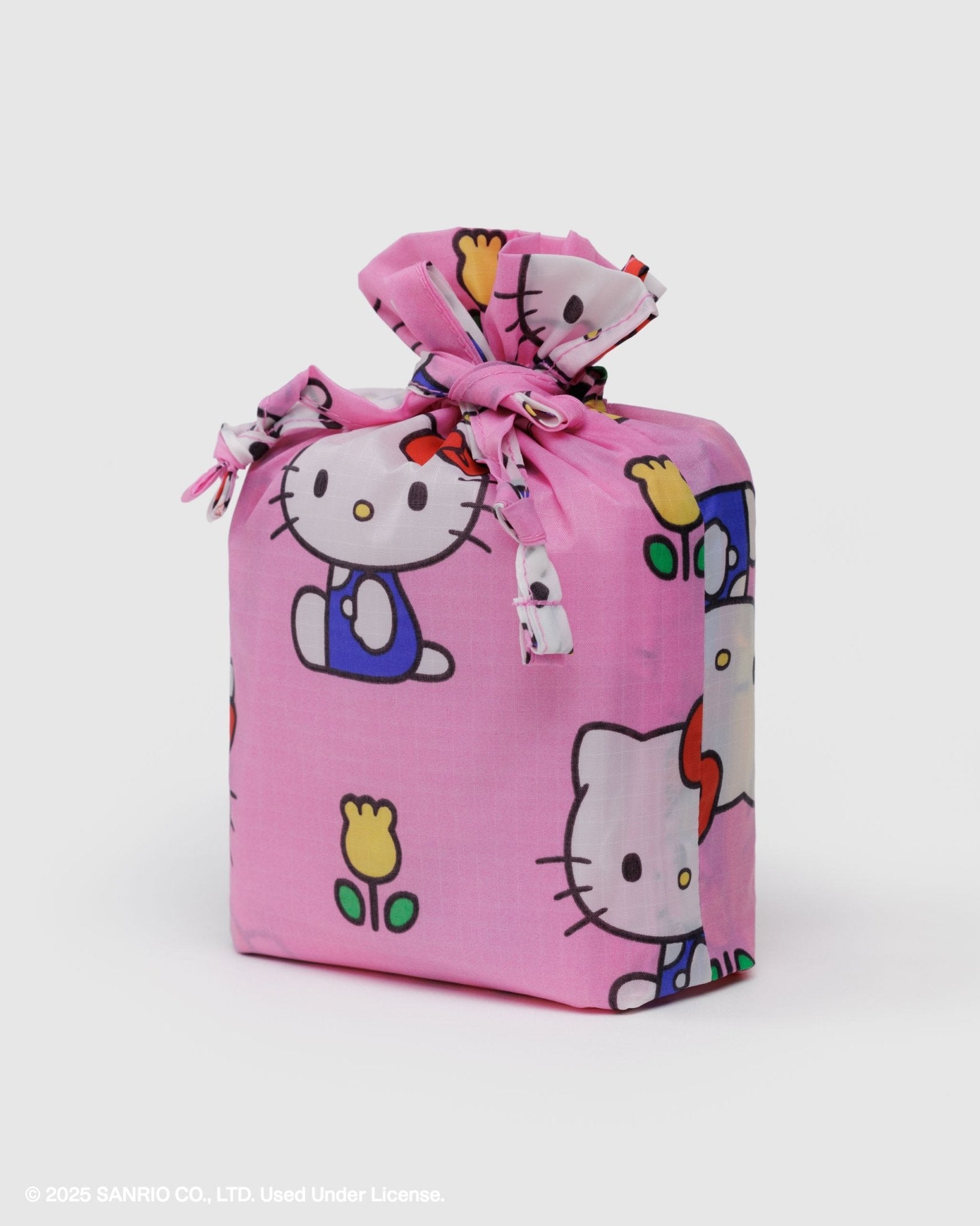 Pink gift bag with Hello Kitty design on a white background