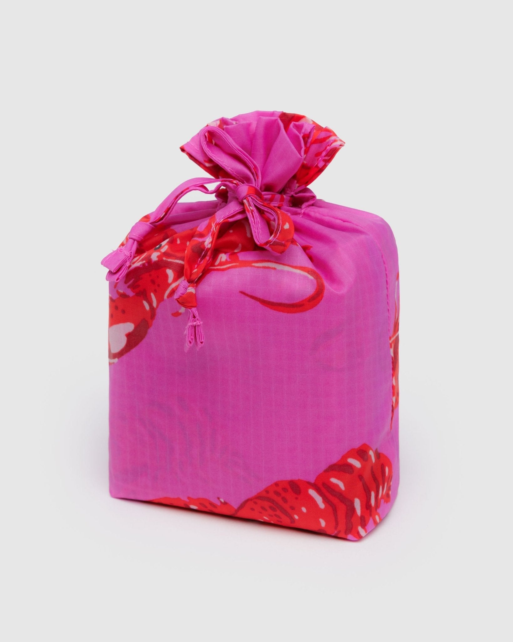Pink storage bag with red lobster patterns and 3 standard reusable bags inside