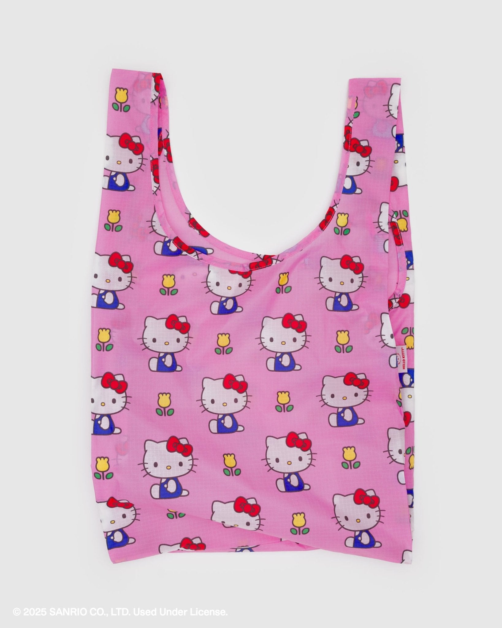 Pink reusable bag with Hello Kitty pattern and yellow floral pattern